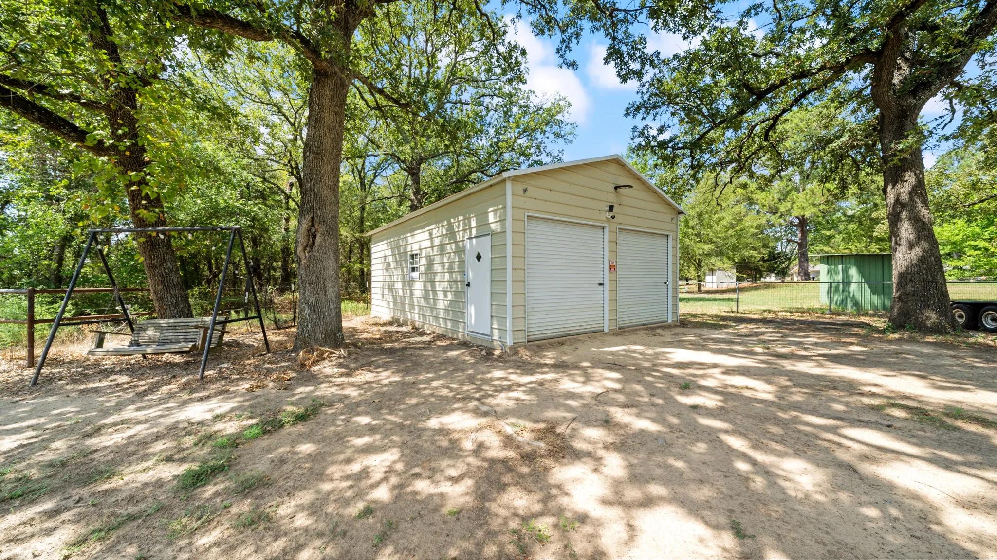 Freestanding two-car garage with a side entry door