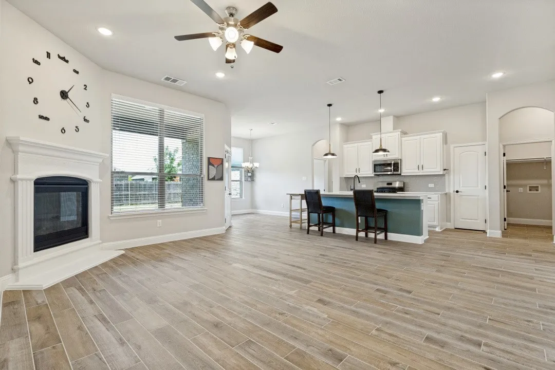 Large open main area with the porcelain ceramic wood plank tile flooring, extremely resilient to damage and as easy as possible to clean . Great for kids and pets.