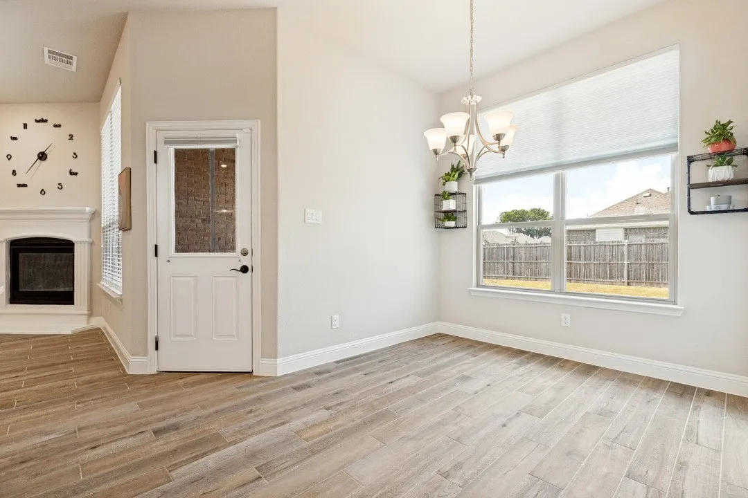 Huge breakfast nook and, again, the porcelain ceramic wood plank tile throughout the main part of the home