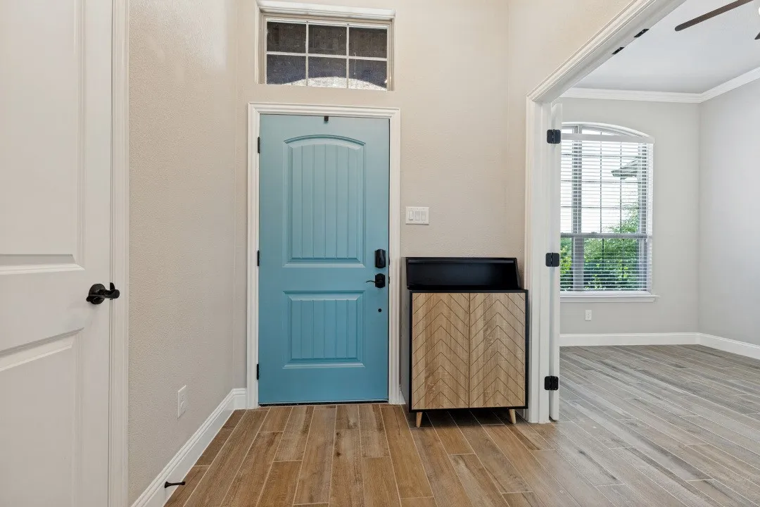 Oversize study to the right here as soon as you walk in, with a ceiling fan and windows throughout the main part of the home. You have the porcelain ceramic wood plank tiles, almost indestructible with kids and pets