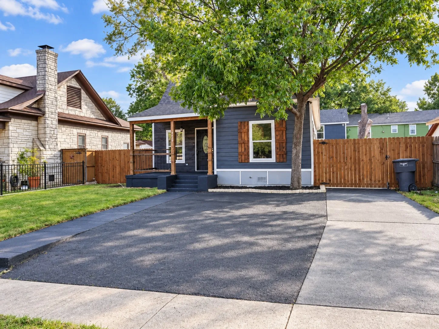 Contemporary exterior with dark siding and white trim