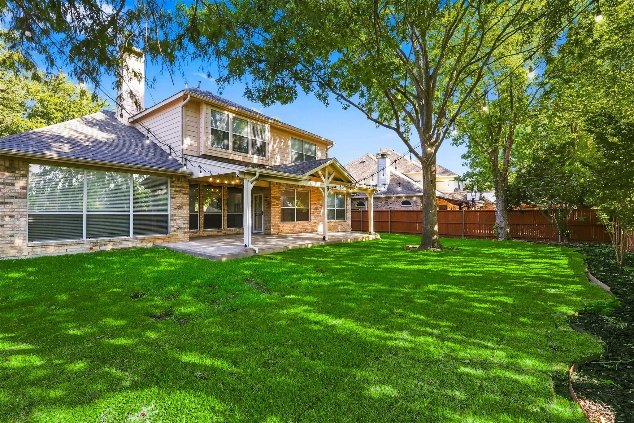 Huge backyard with professionally built covered patio. Brand new lush green grass sodded in Aug 2026