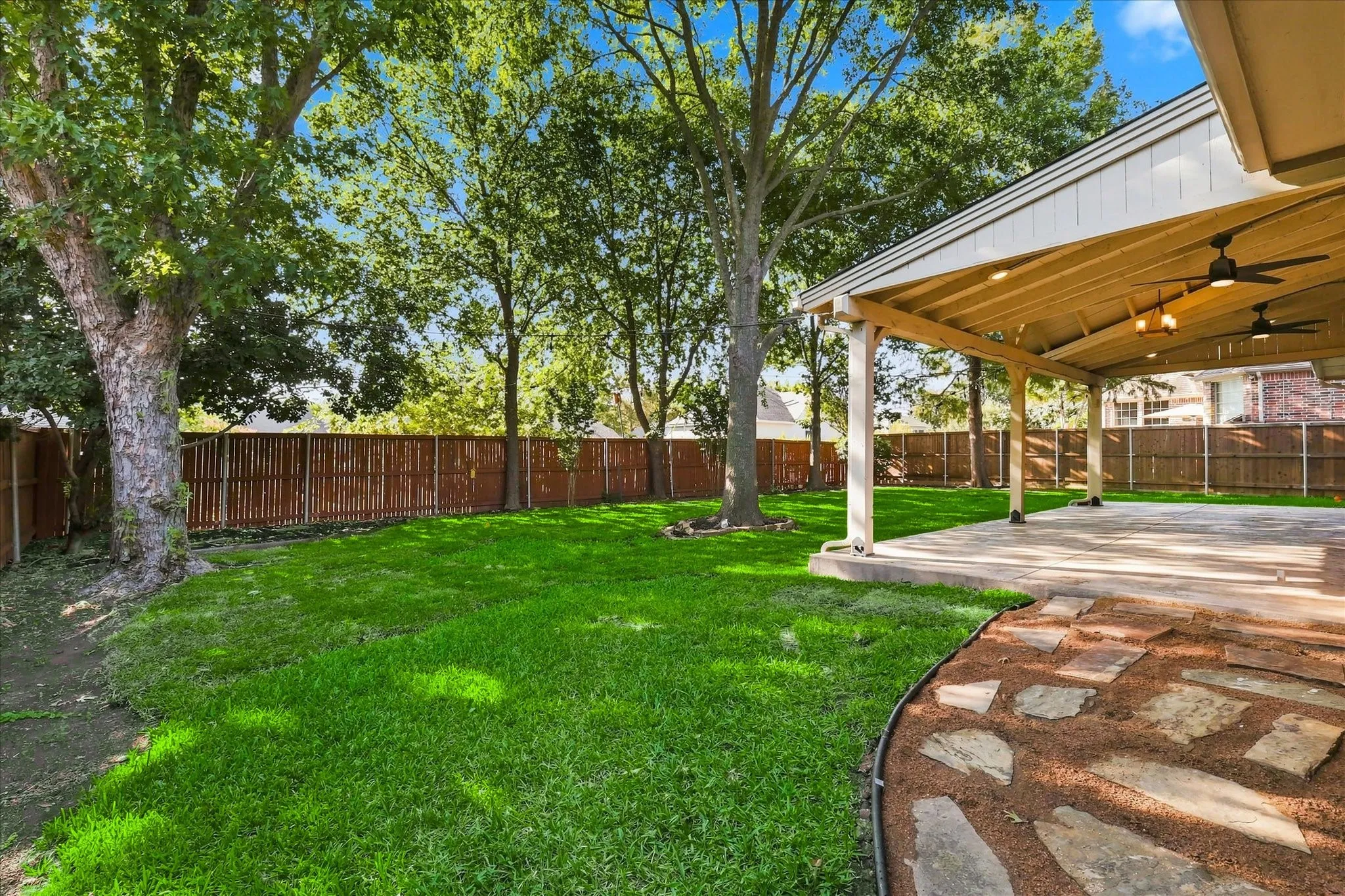 Huge backyard with professionally built covered patio. Brand new grass sodded in Aug 2026