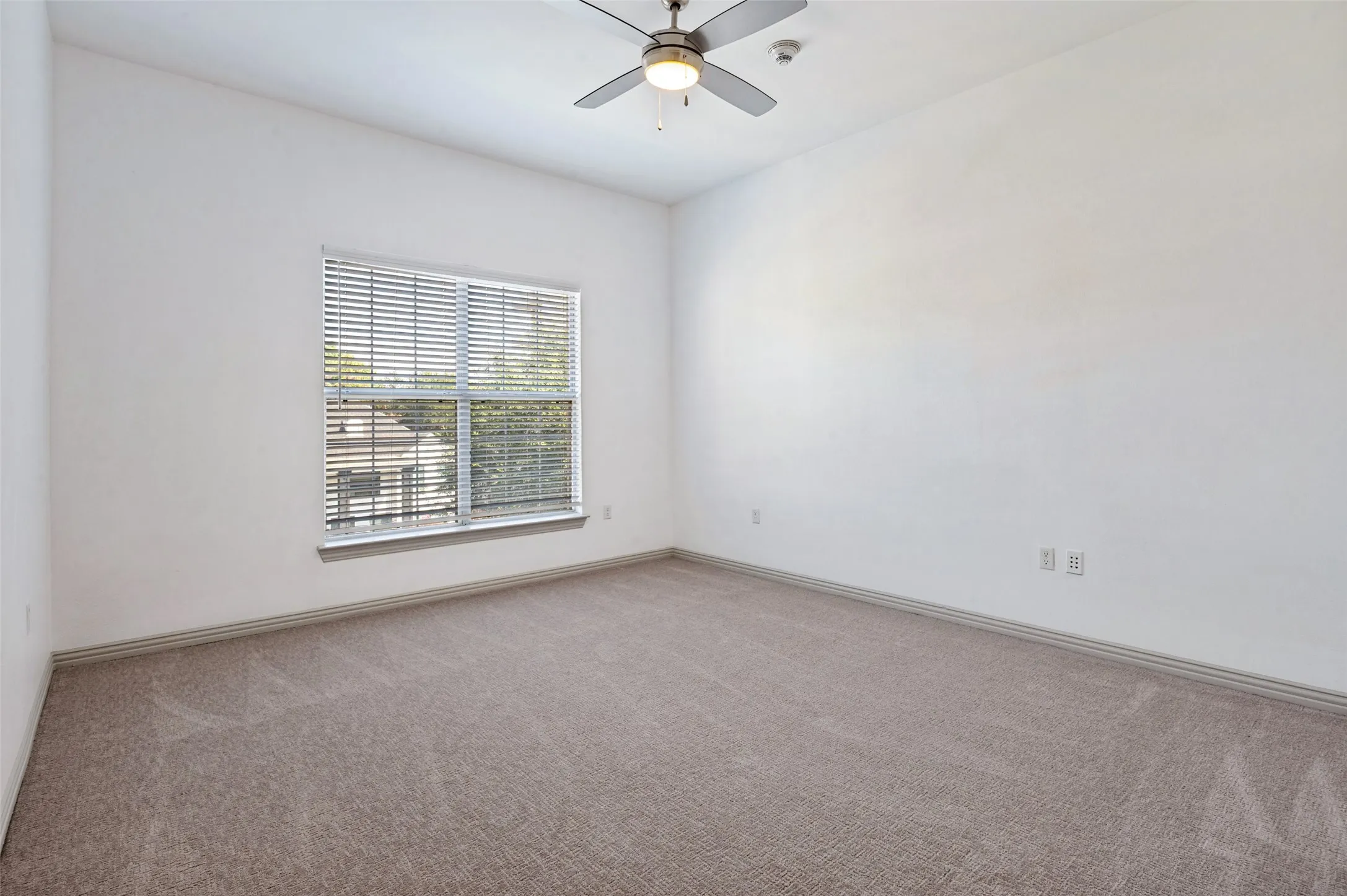 2nd bedroom with ensuite bath and walk-in closet.