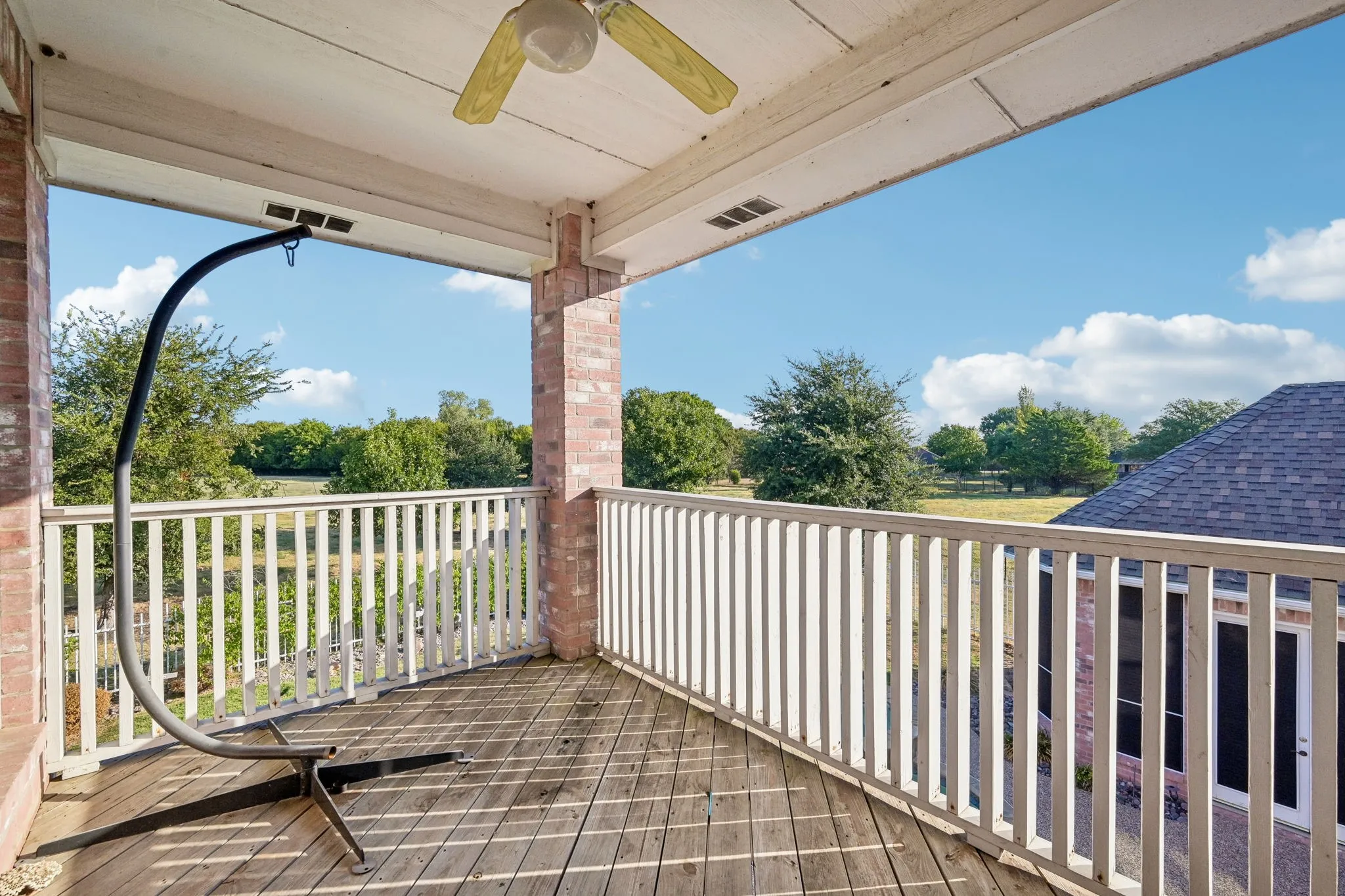 Balcony overlooking pool and acreage
