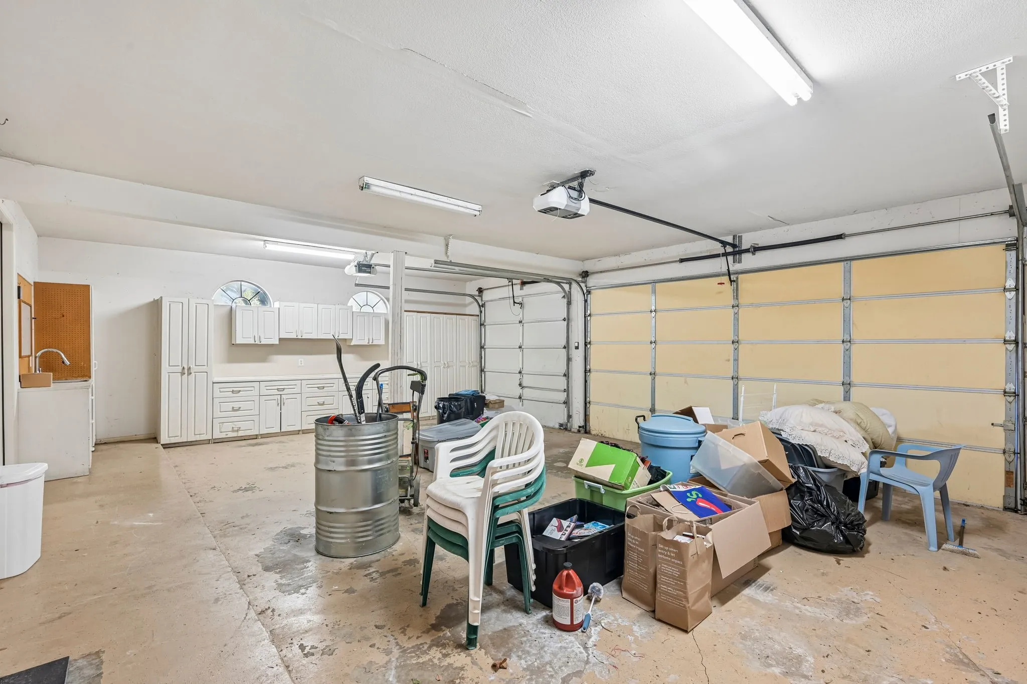 Garage with built-in cabinets & sink