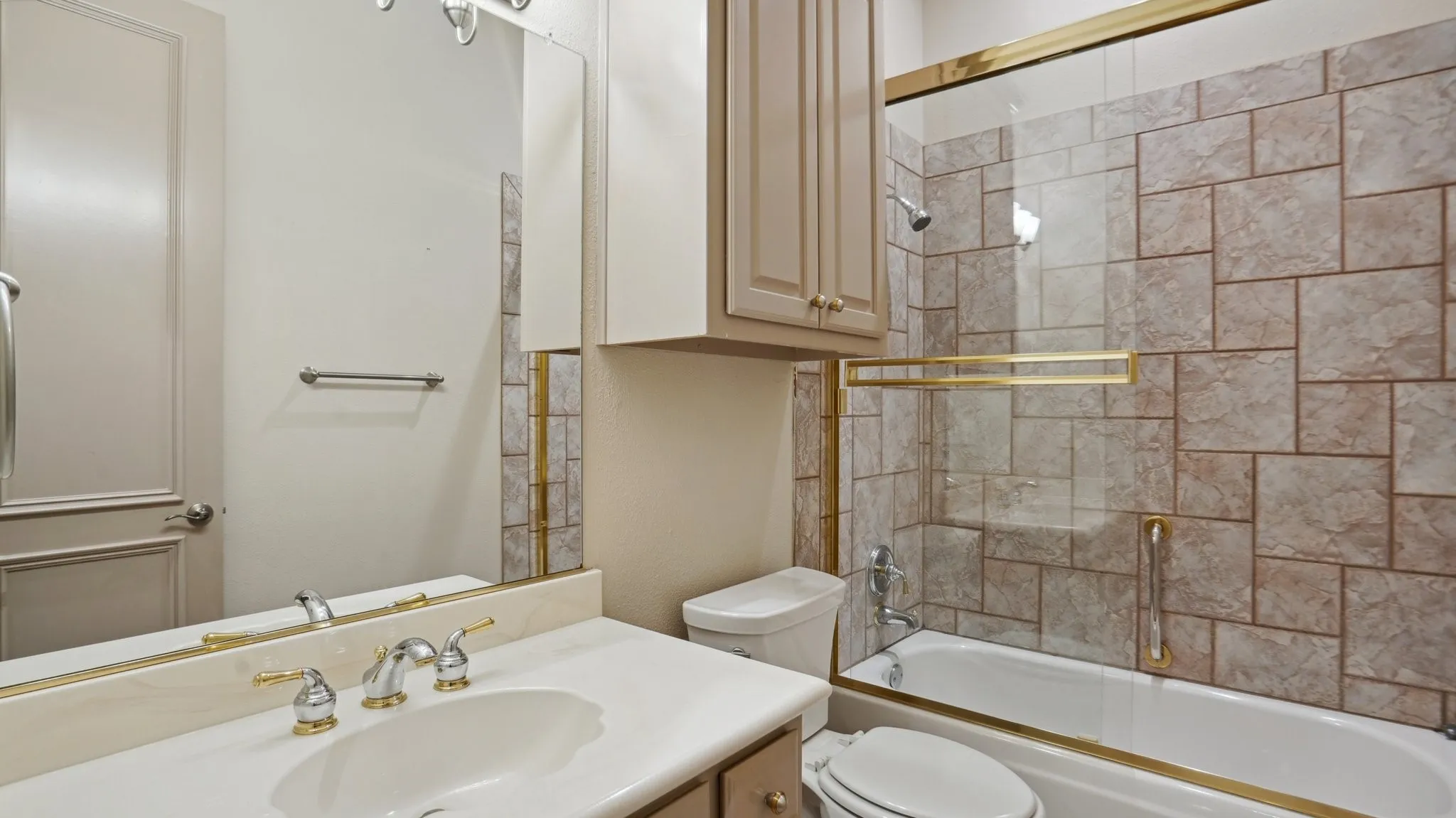 Full bath featuring toilet,  shower combination, and vanity