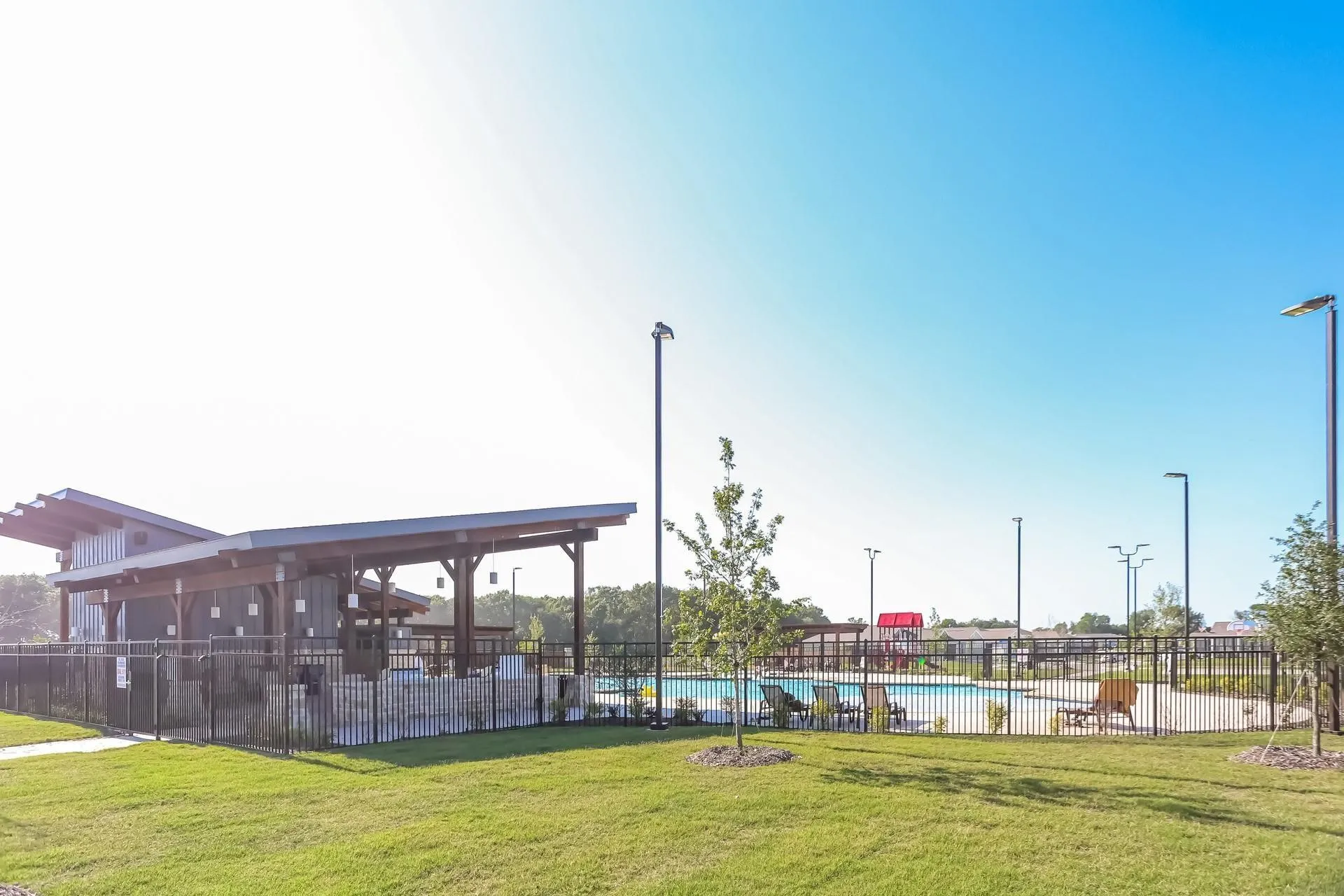 Surrounding community with a pool and a yard