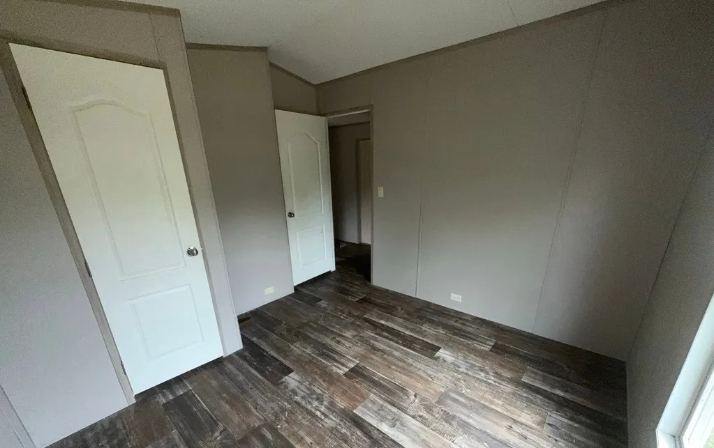 Wood-finish flooring with neutral wall panels