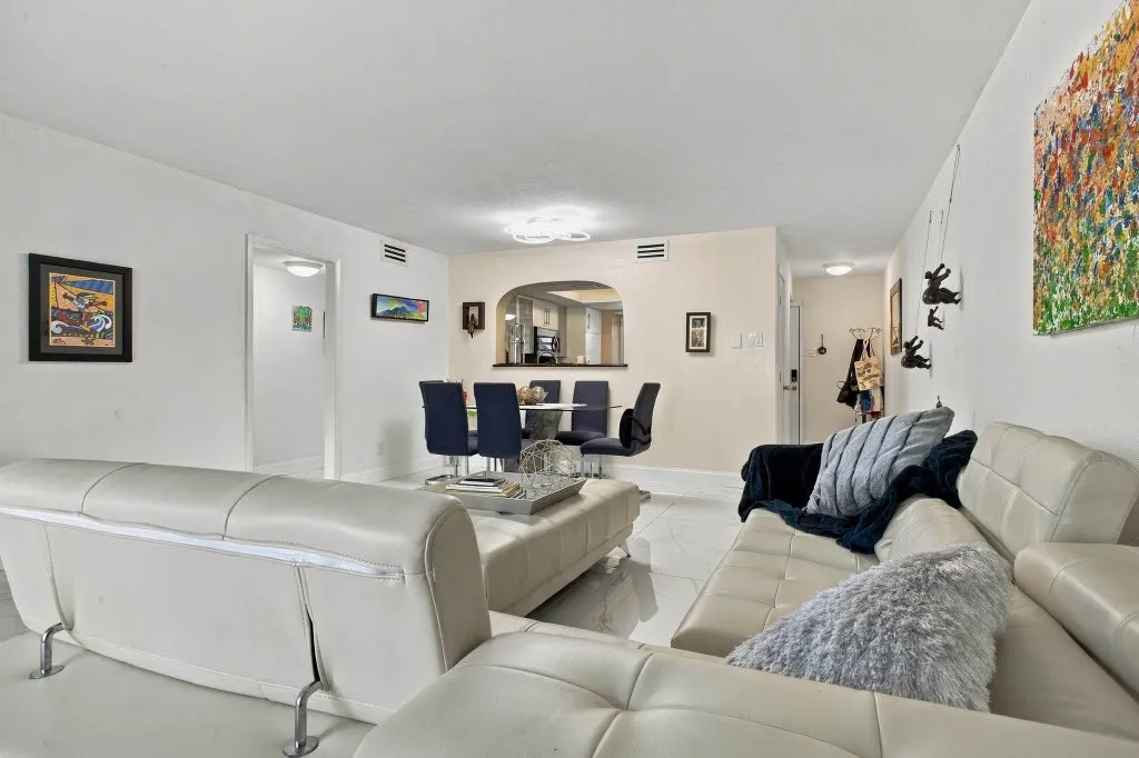 White tile flooring and light-toned walls