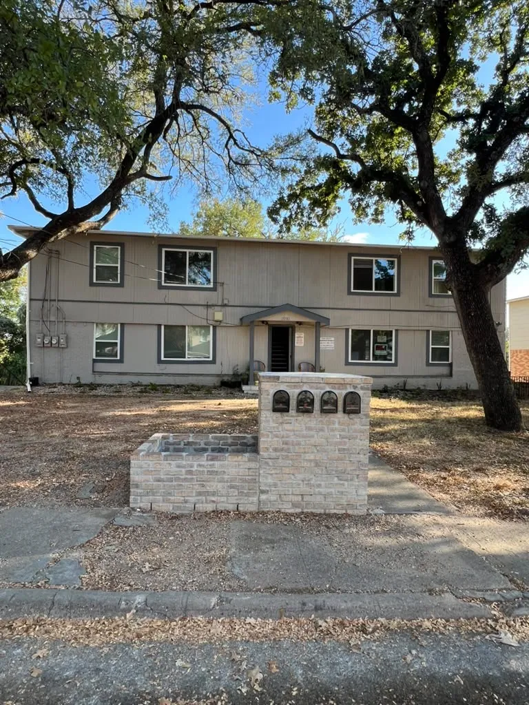 Two-story exterior with a neutral gray facade
