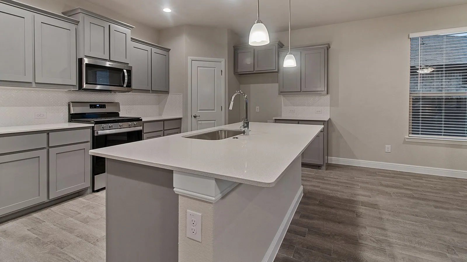 Kitchen- All Home and community information, including pricing, included features, terms, availability and amenities, are subject to change at any time without notice or obligation. All Drawings, pictures, photographs, video, square footages, floor plans, elevations, features, colors and sizes are approximate for illustration purposes only and will vary from the homes as built.
