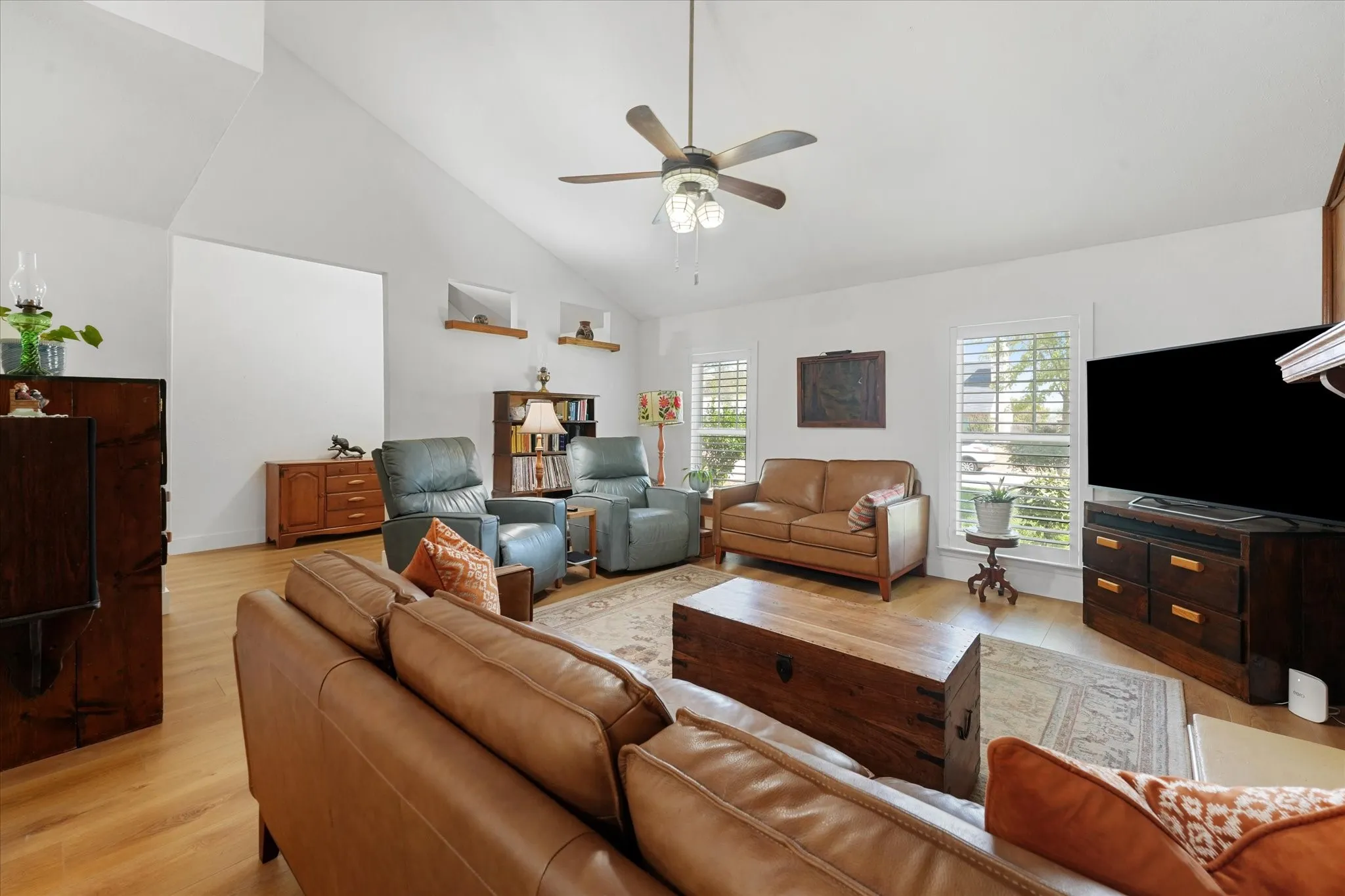 Main living room features new floors throughout, floor to ceiling fireplace, open floor plan, and is very spacious.
