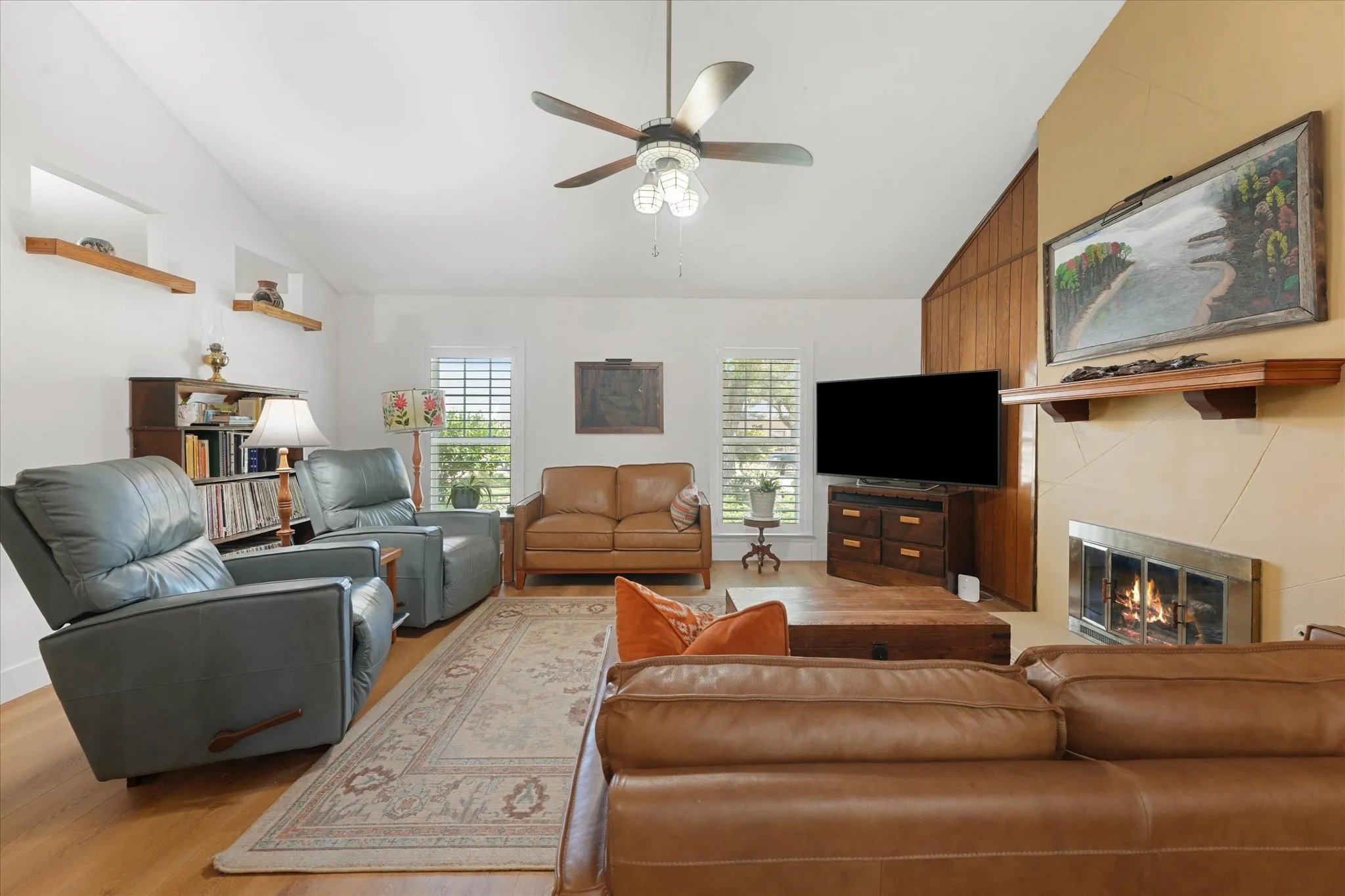 Main living room features new floors throughout, floor to ceiling fireplace, open floor plan, and is very spacious.