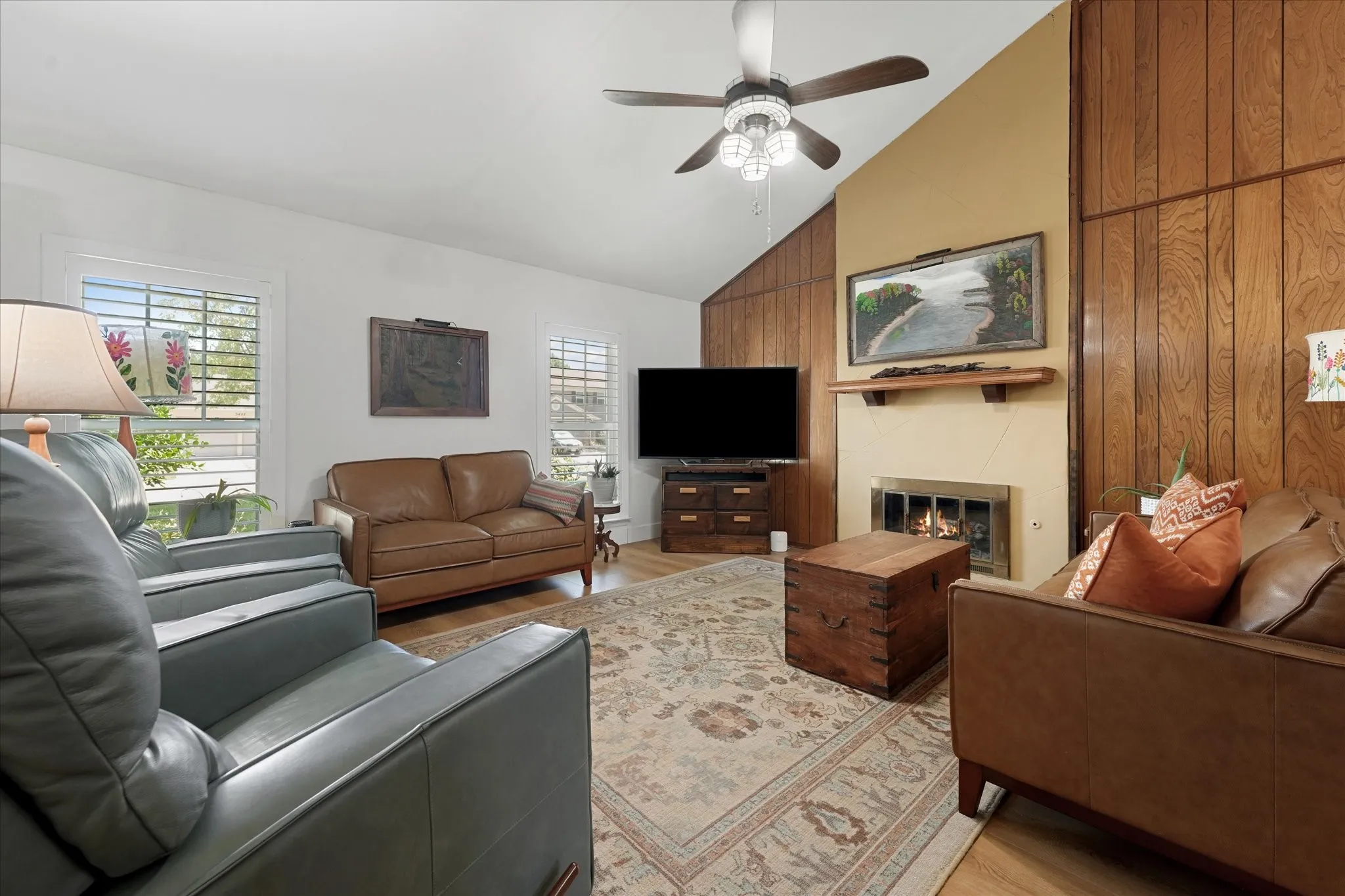 Main living room features new floors throughout, floor to ceiling fireplace, open floor plan, and is very spacious.