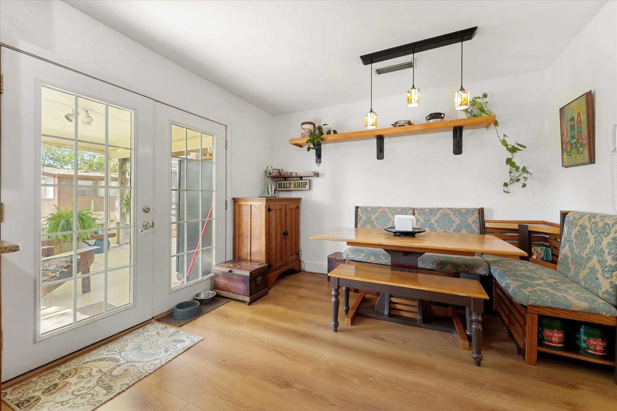 Breakfast nook in kitchen off screened in patio