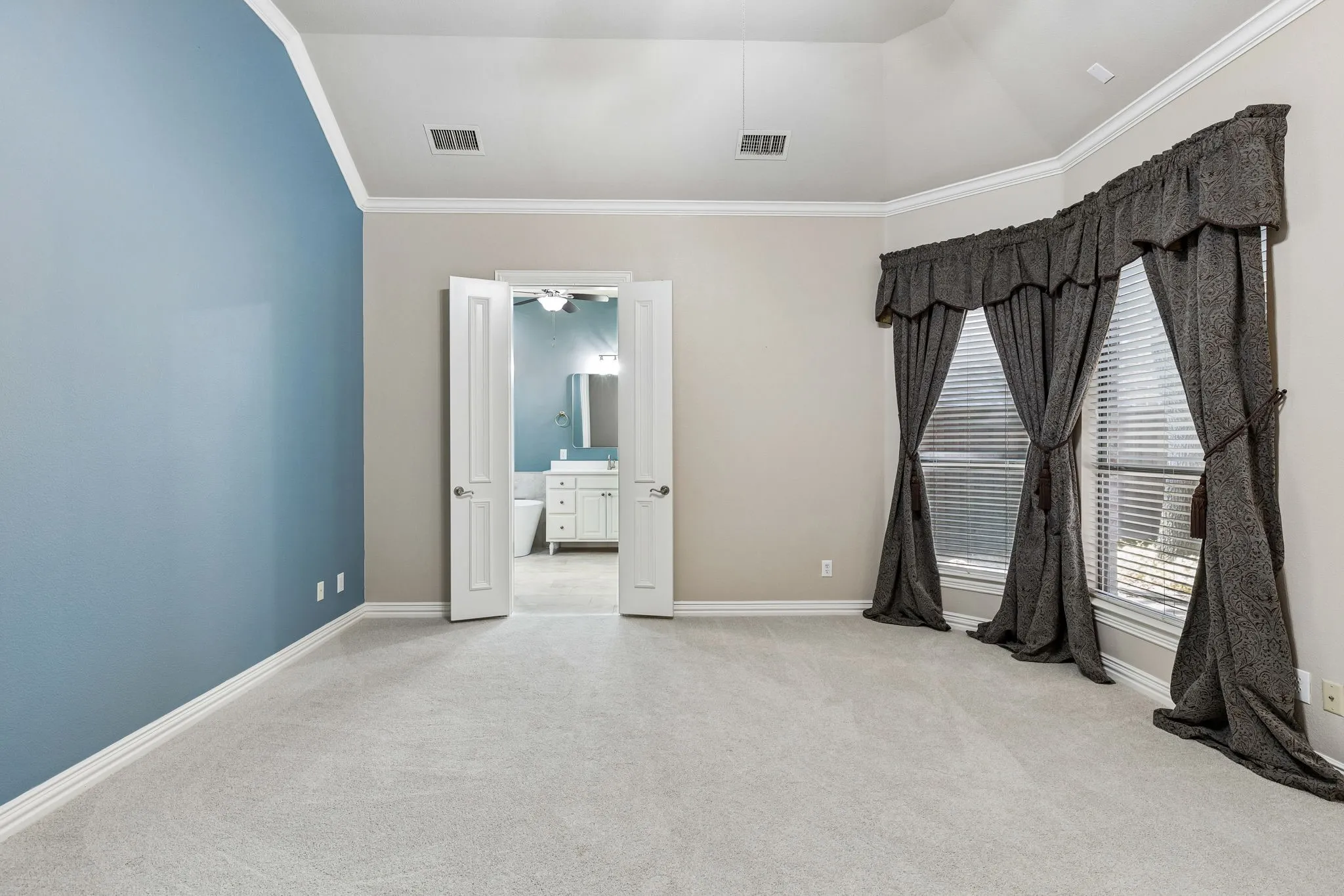 Downstairs Primary Bedroom with ensuite bath and spacious walk-in closet