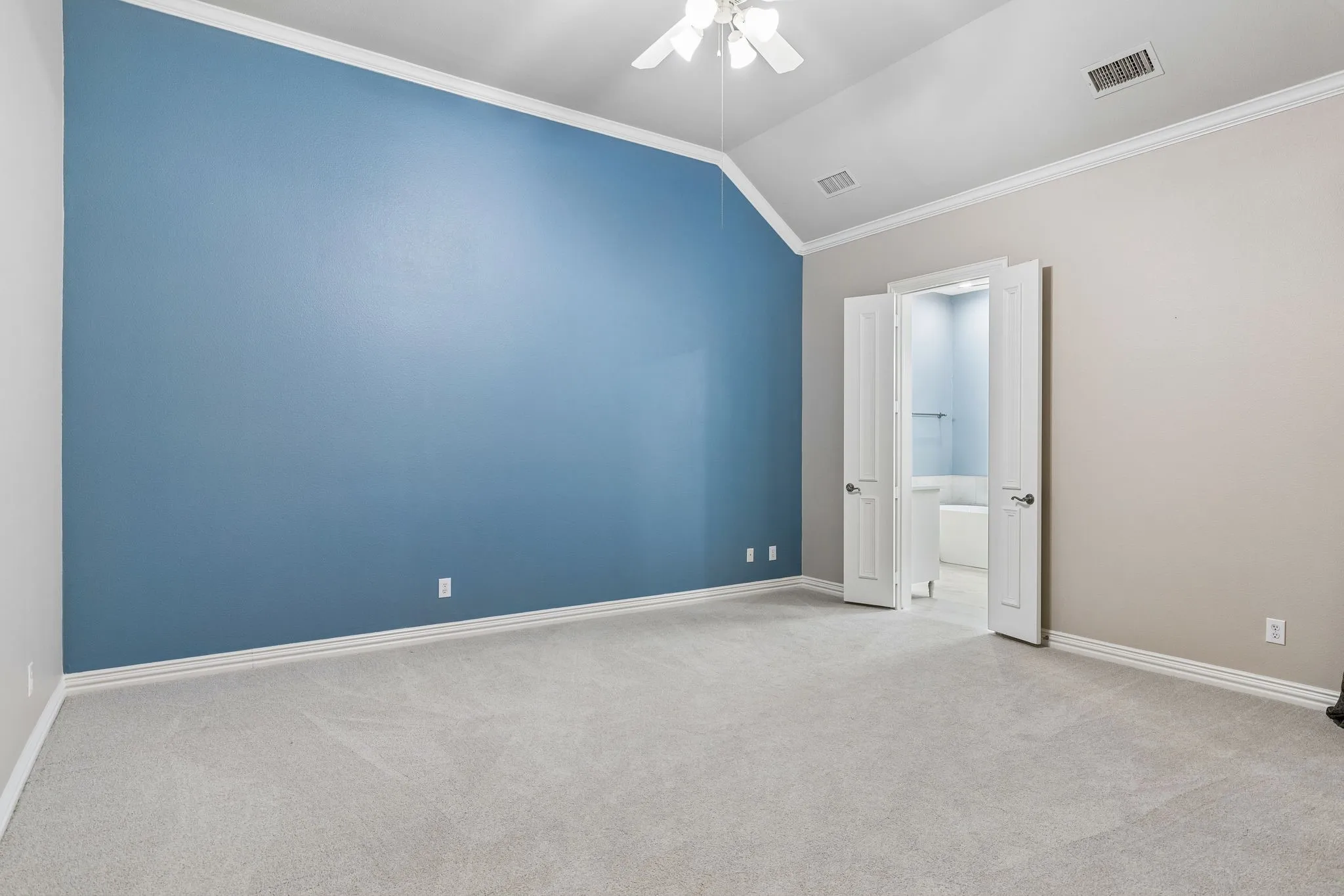 Downstairs Primary Bedroom with ensuite bath and spacious walk-in closet