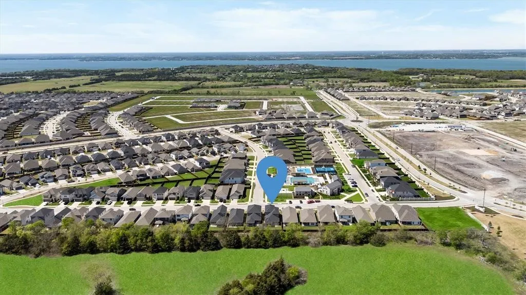 Residential community with extensive neighborhood development and a distant body of water
