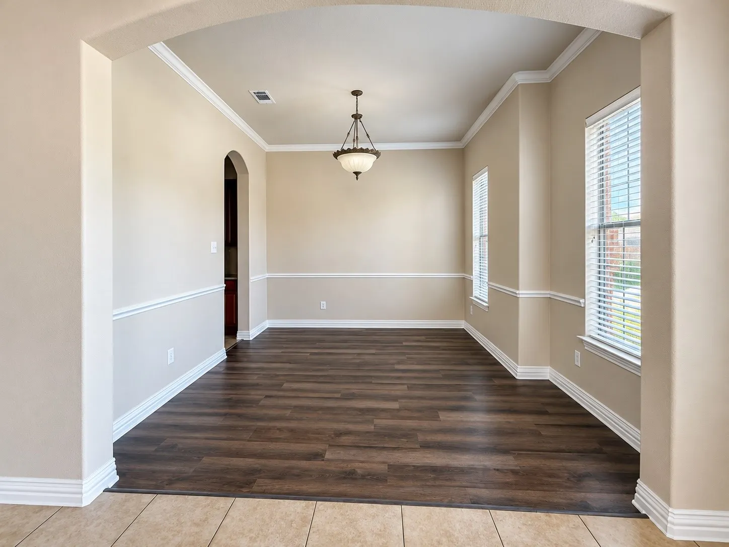 Wood-finish flooring with arched entryway