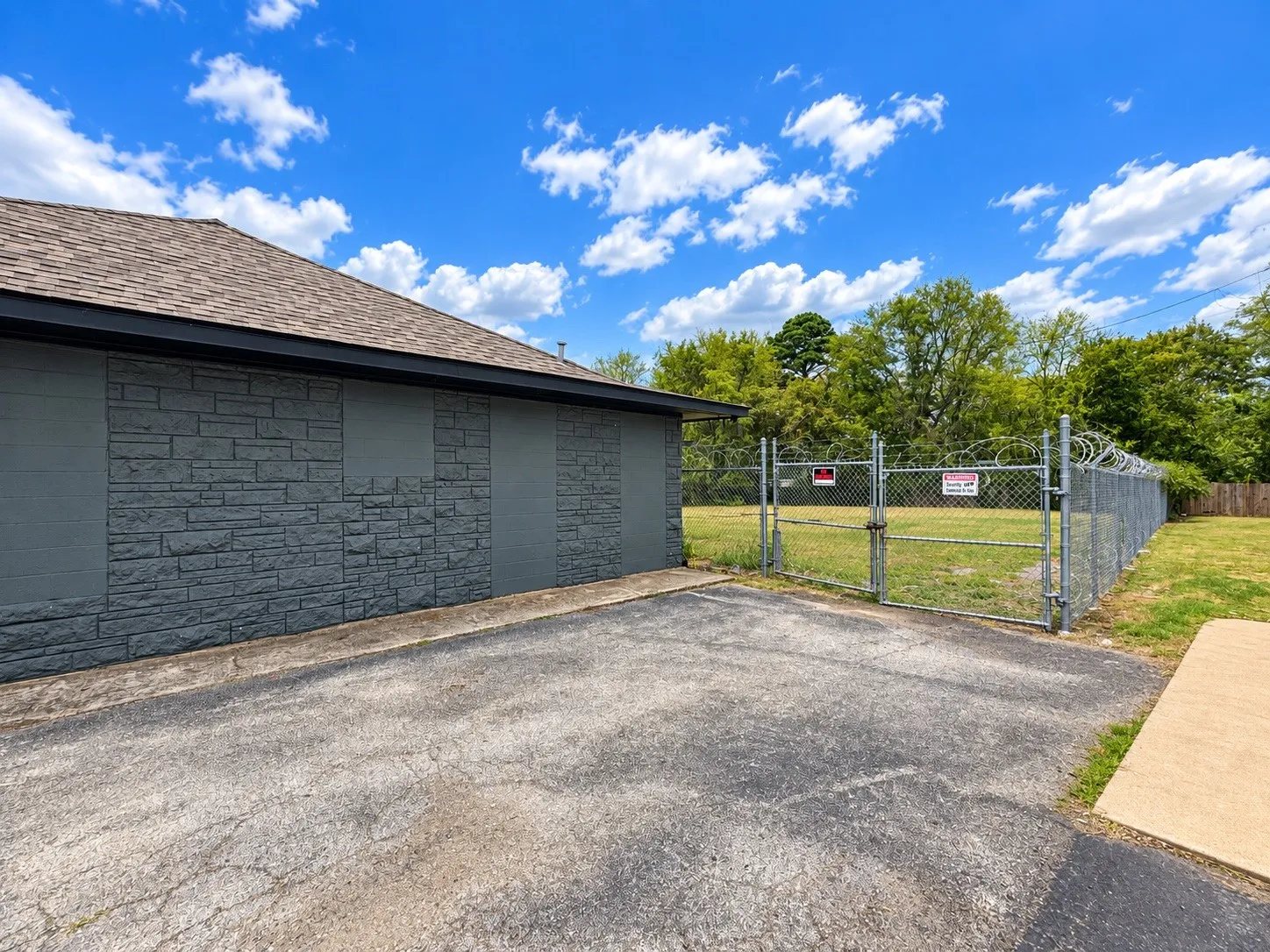 Exterior building featuring stacked stone and stucco finishes