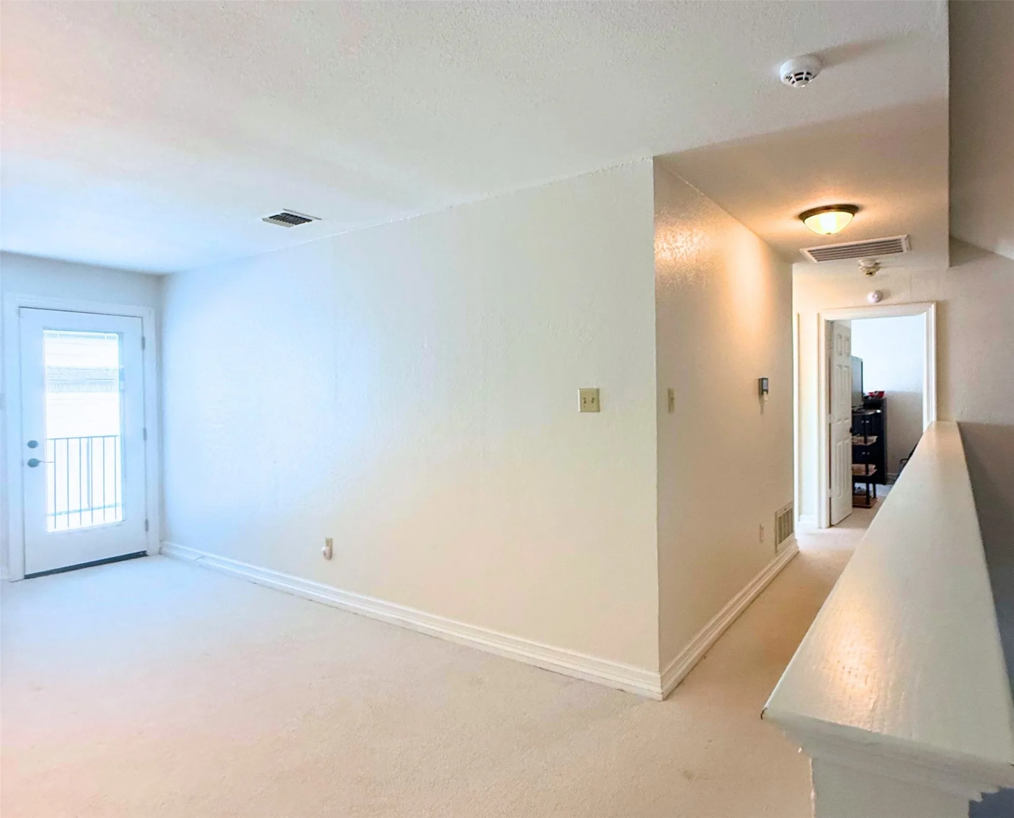 View from upstairs game room towards bedrooms and bath.