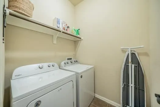 Laundry area with a permanent shelf and a clothing rod, plenty of storage