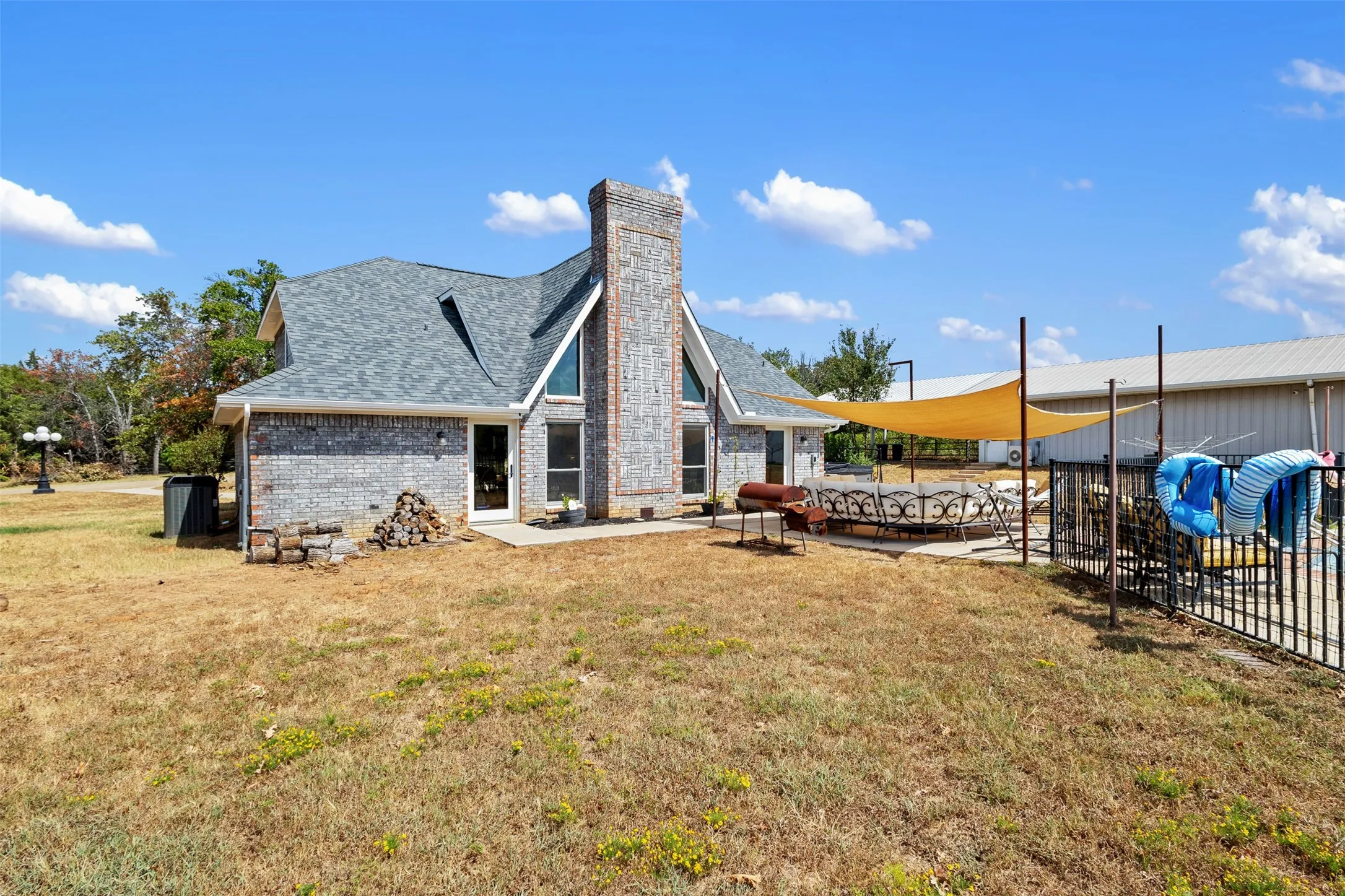 Brick exterior with a prominent chimney and gabled roofline
