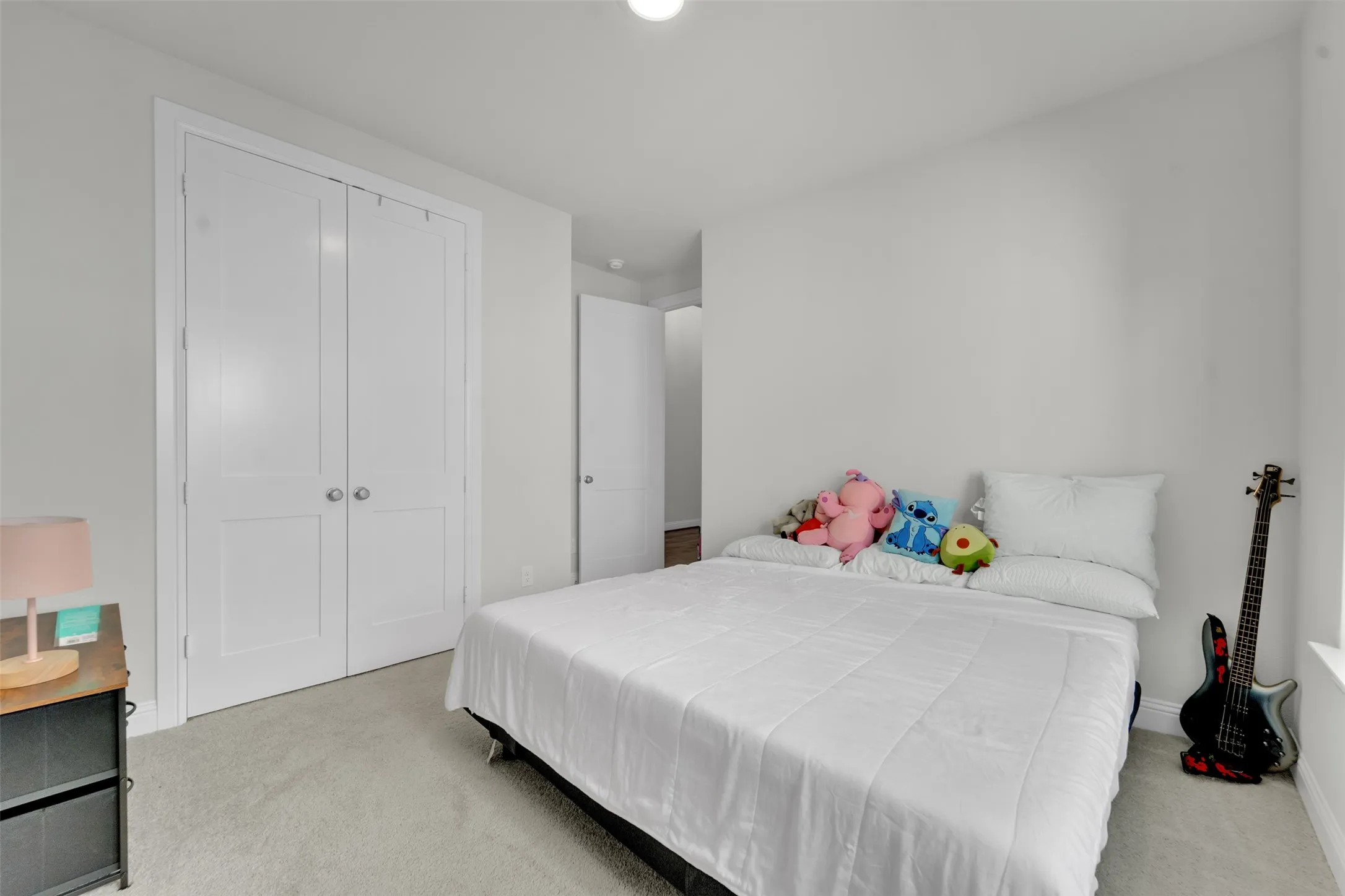 Light neutral-tone walls complement plush carpeting