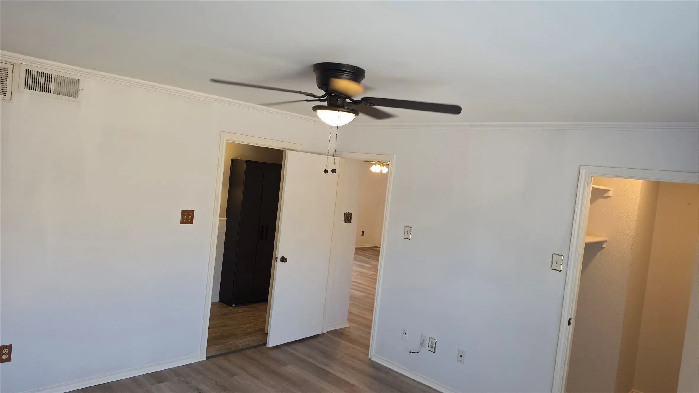 Bedroom showing closet and bathroom entries