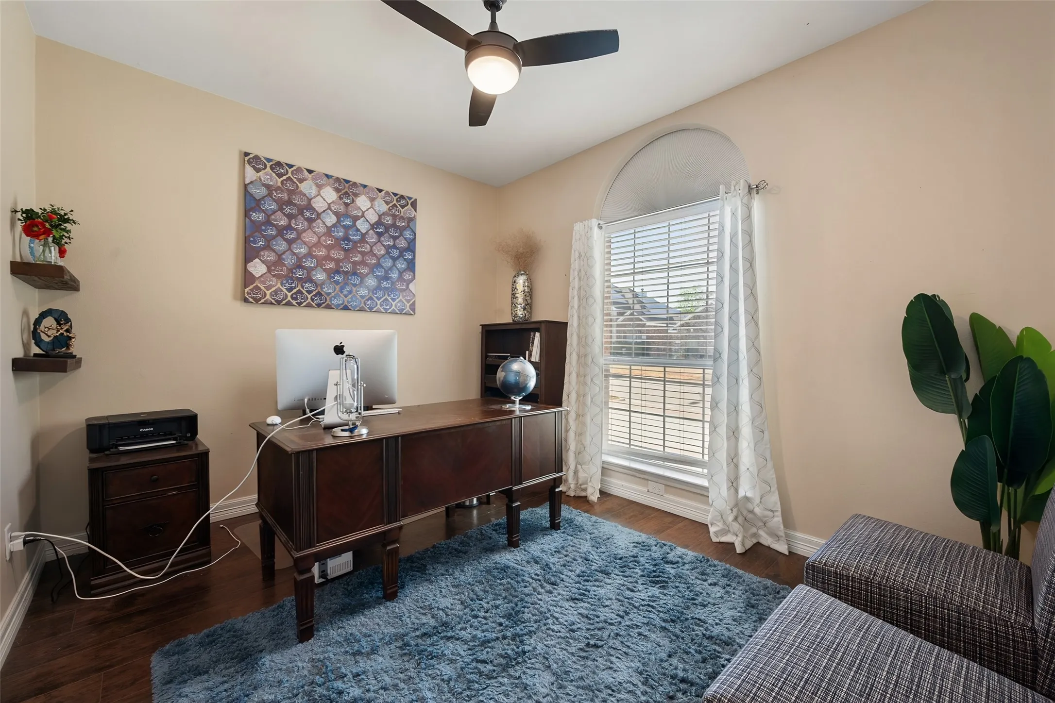 Warm neutral walls with wood-finish flooring