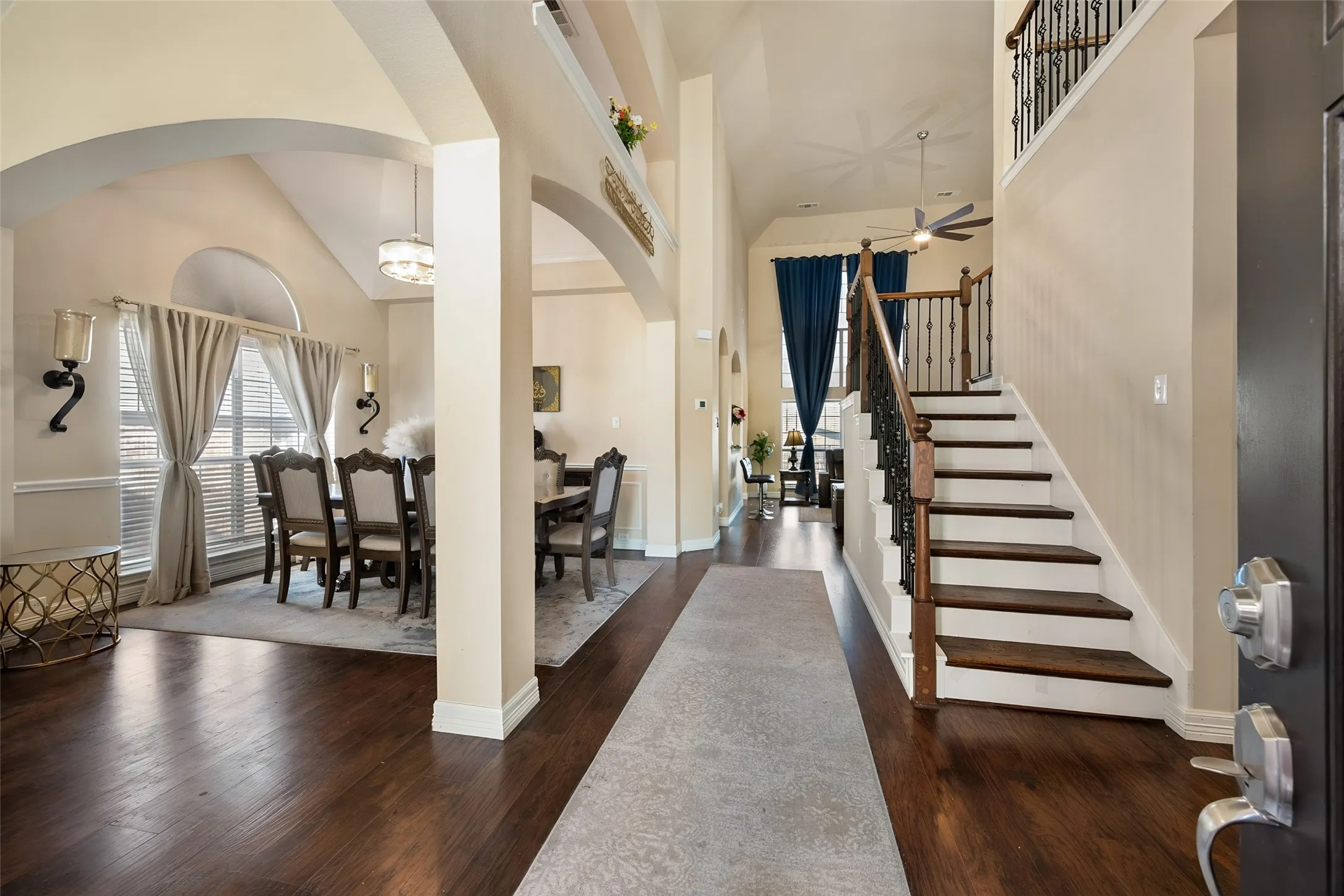 Entry way with view of stairs,formal dining and a second living area is to the left
