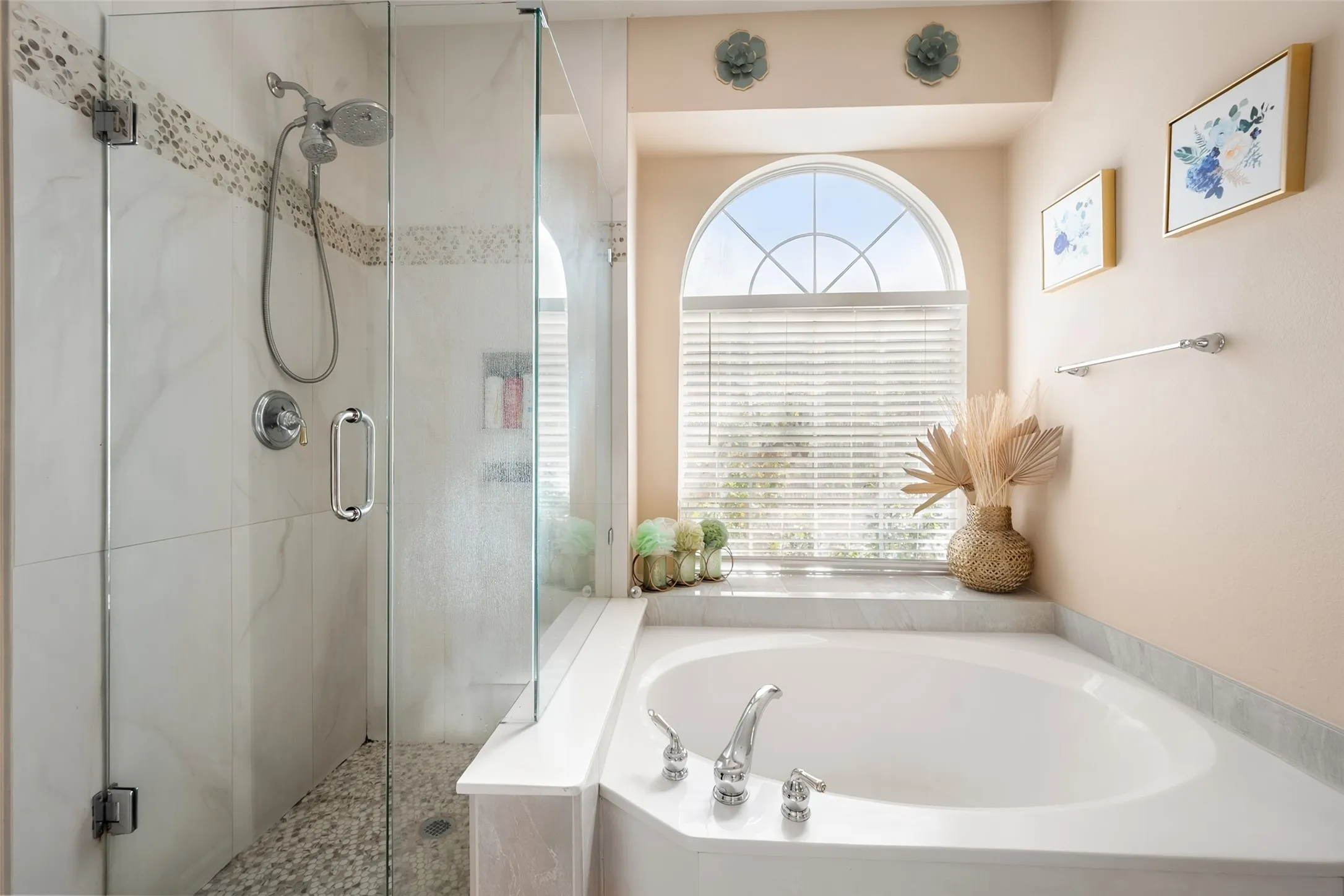 Master bathroom,Glass-enclosed shower with a handheld showerhead and mosaic tile accent