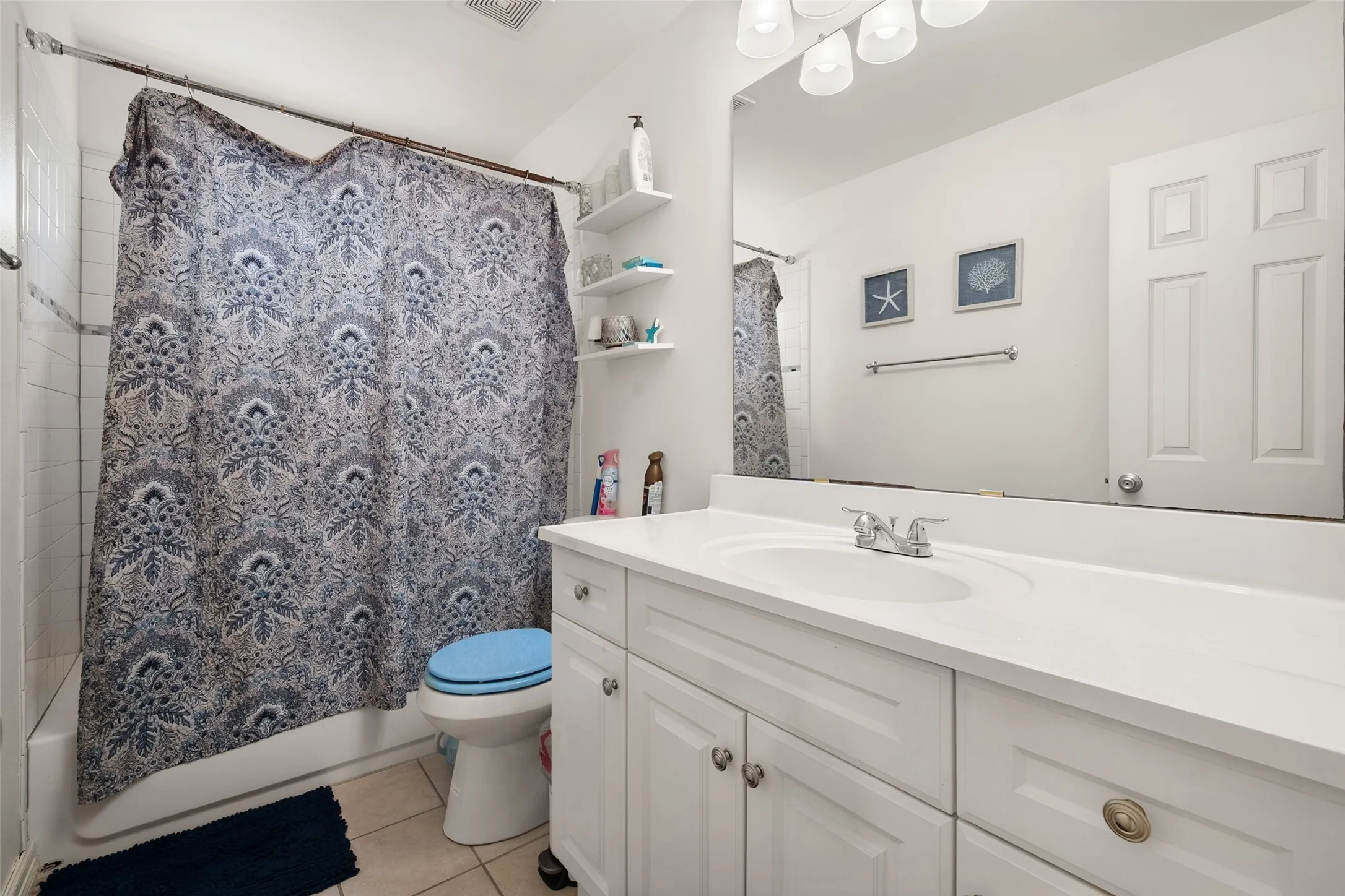 up stairs bathroom,White vanity with panel-front cabinetry, integrated sink, and chrome faucet