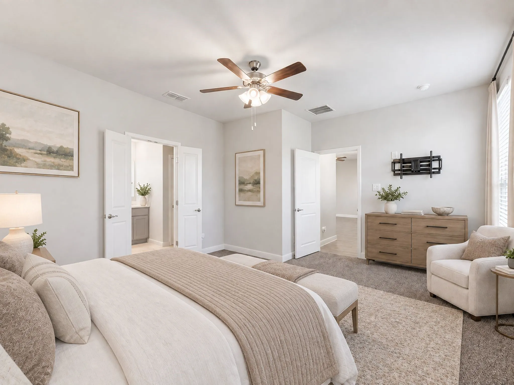 Spacious room with a ceiling fan, light gray wall tones, and recessed lighting