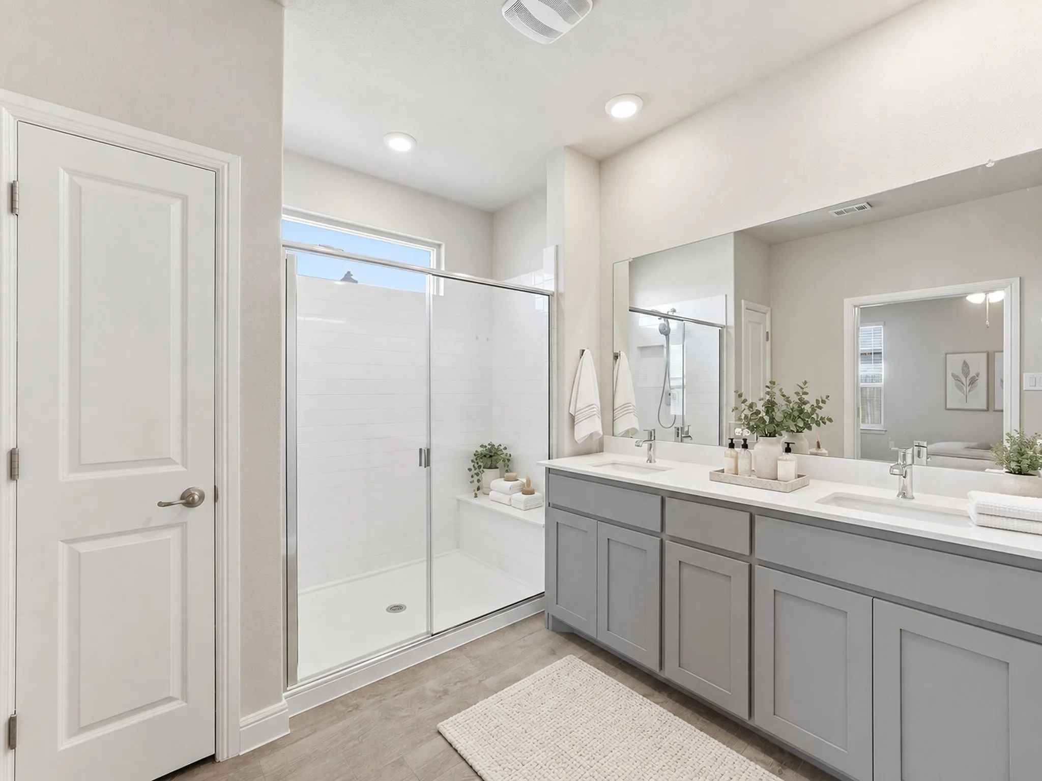 Dual vanity with quartz-finish countertops and undermount sinks