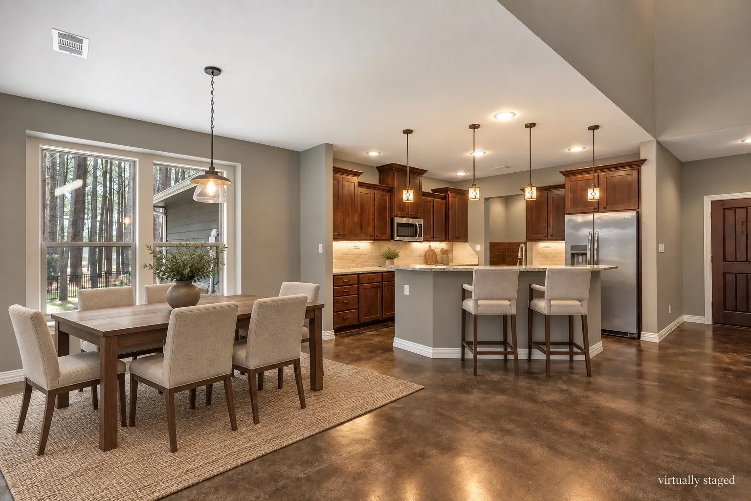 Virtually staged Kitchen open to dining and family room