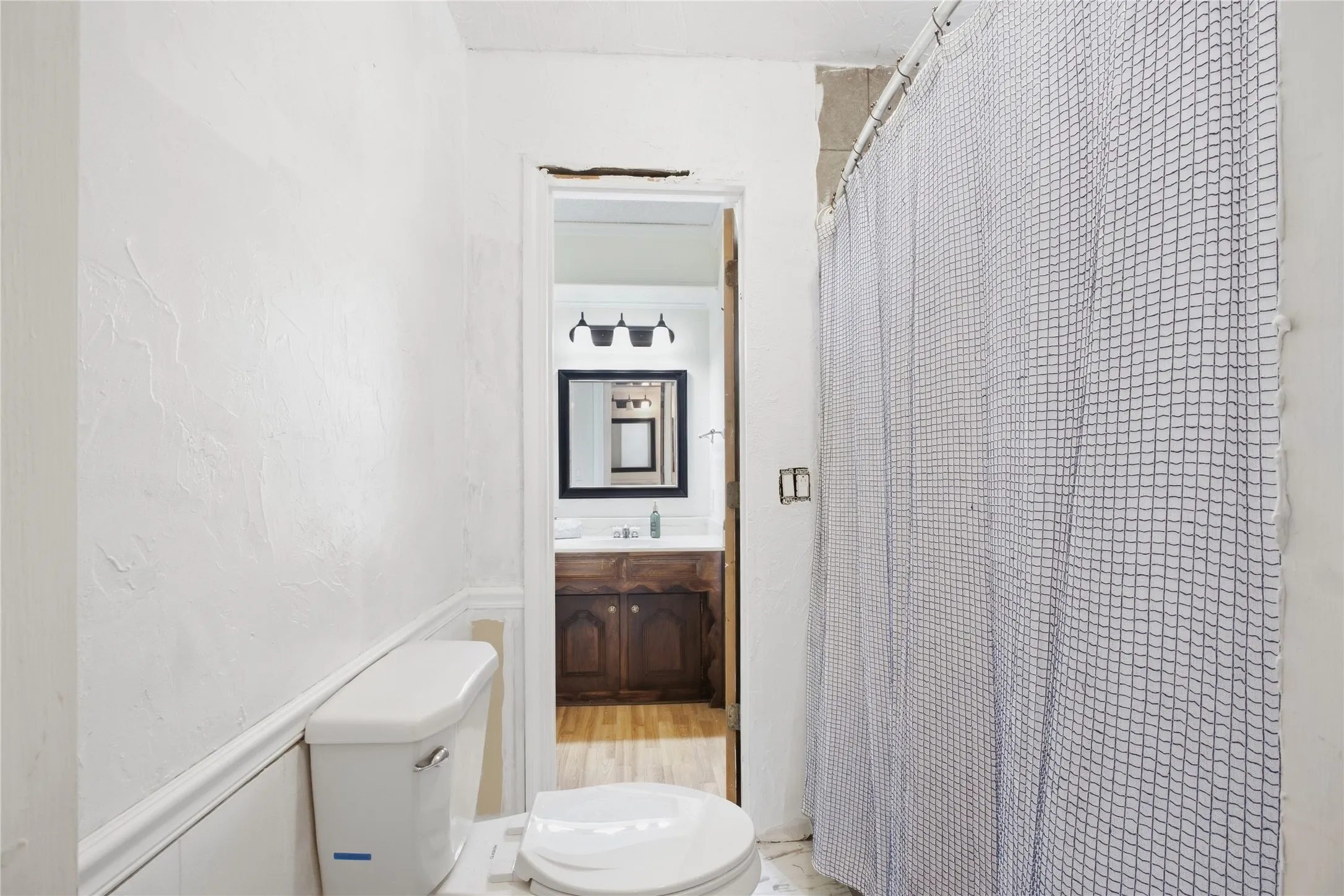White toilet with a dual-flush mechanism