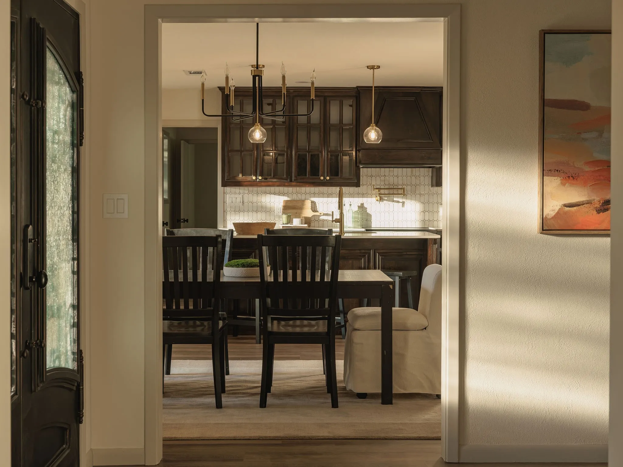 Rich color, natural materials and layered finishes begin at the entry.
