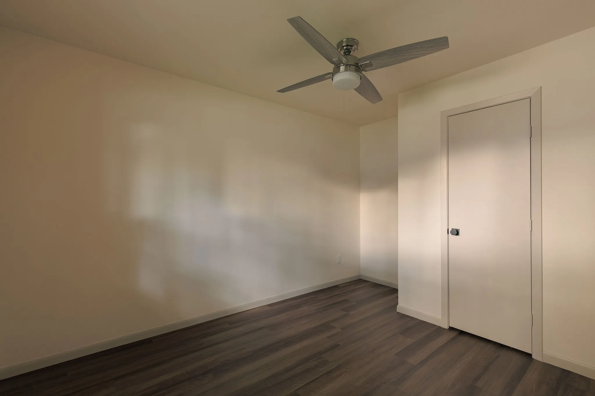 One of three additional bedrooms, offering abundant natural light and flexibility for family, guests or a home office.