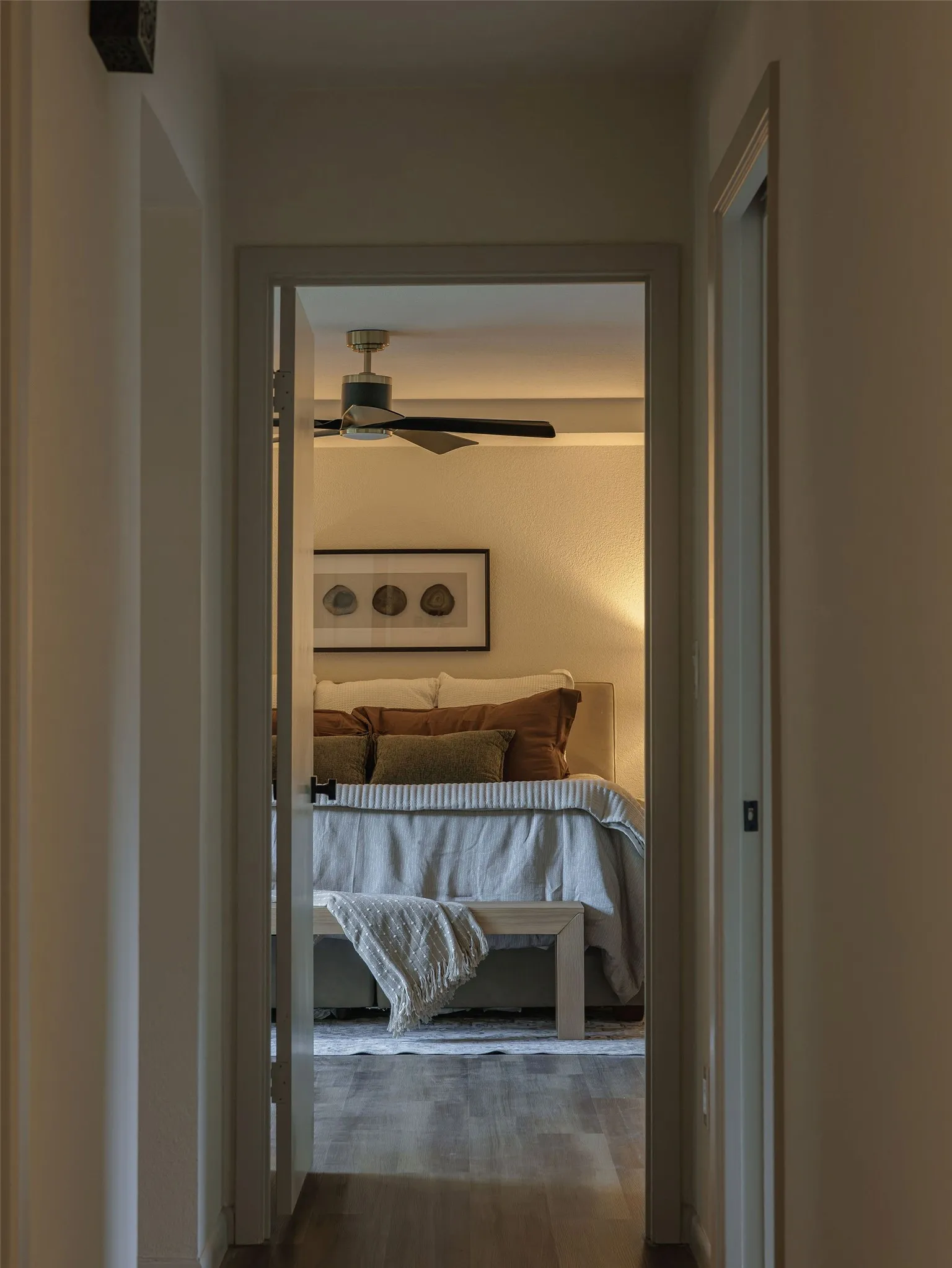The oversized primary suite is tucked away for privacy, creating a quiet retreat from the main living spaces.
