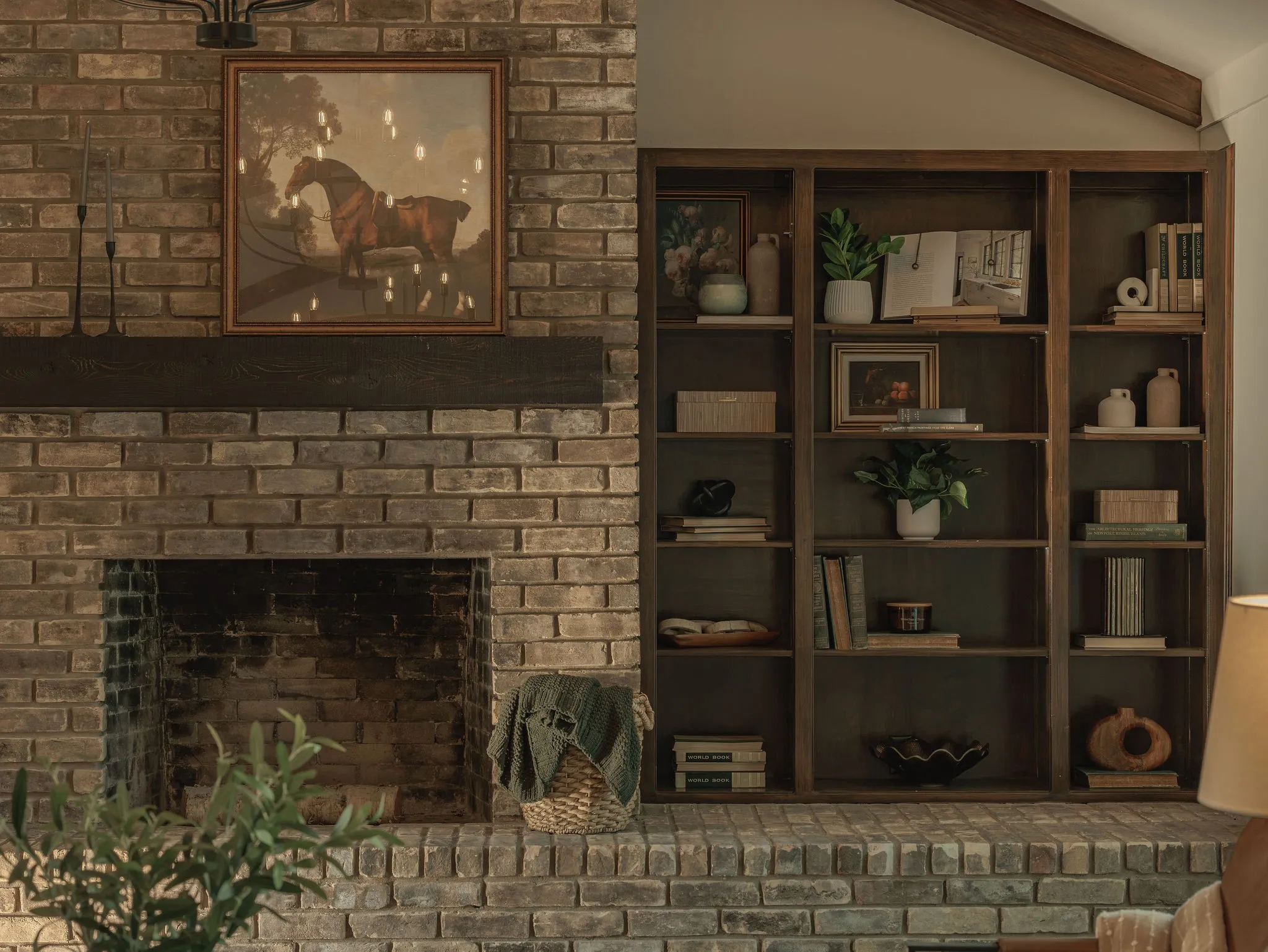 An original brick wood burning fireplace and built in bookcases anchor the living room, preserving the character and warmth of the home.