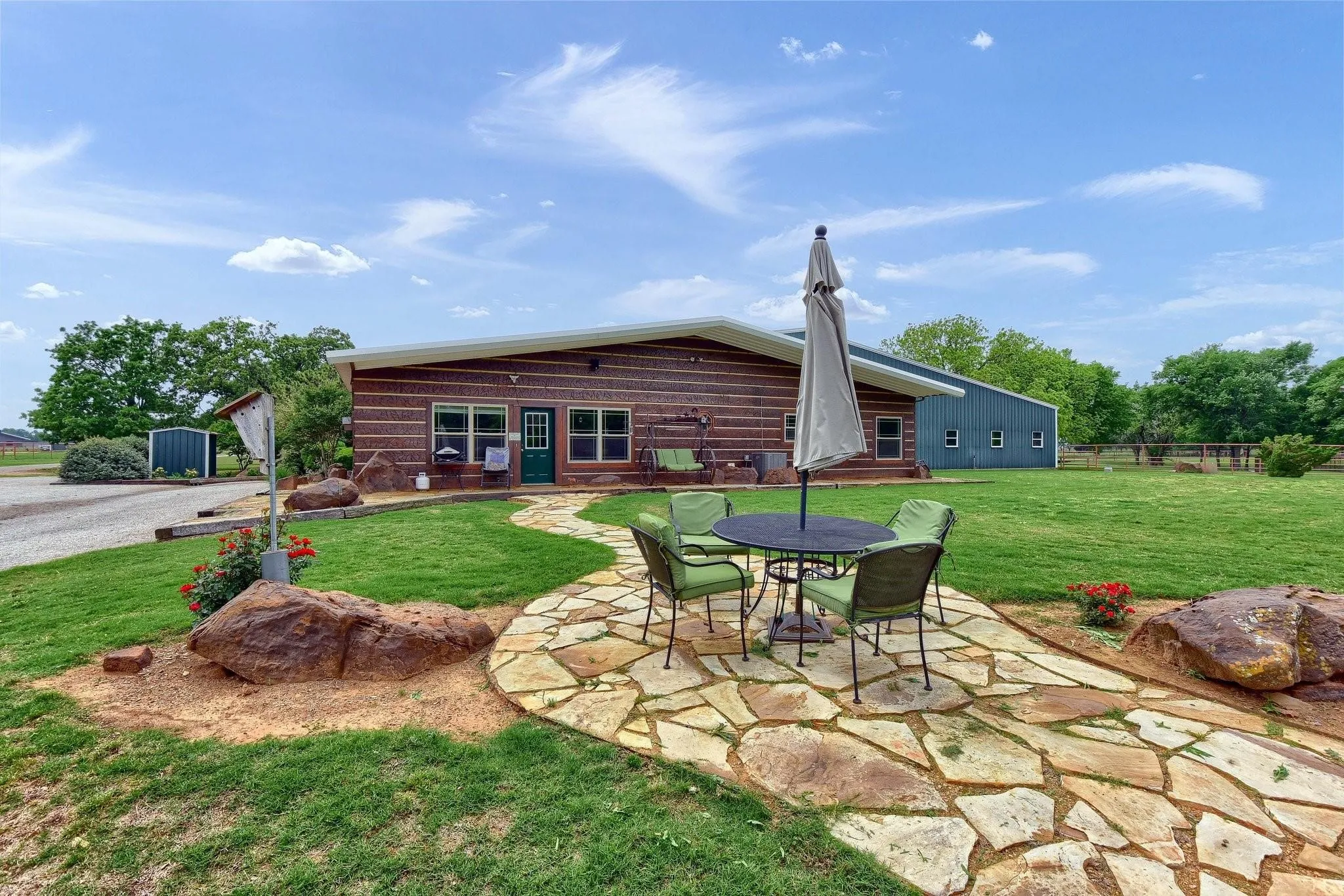 Back of property featuring a lawn and a patio area
