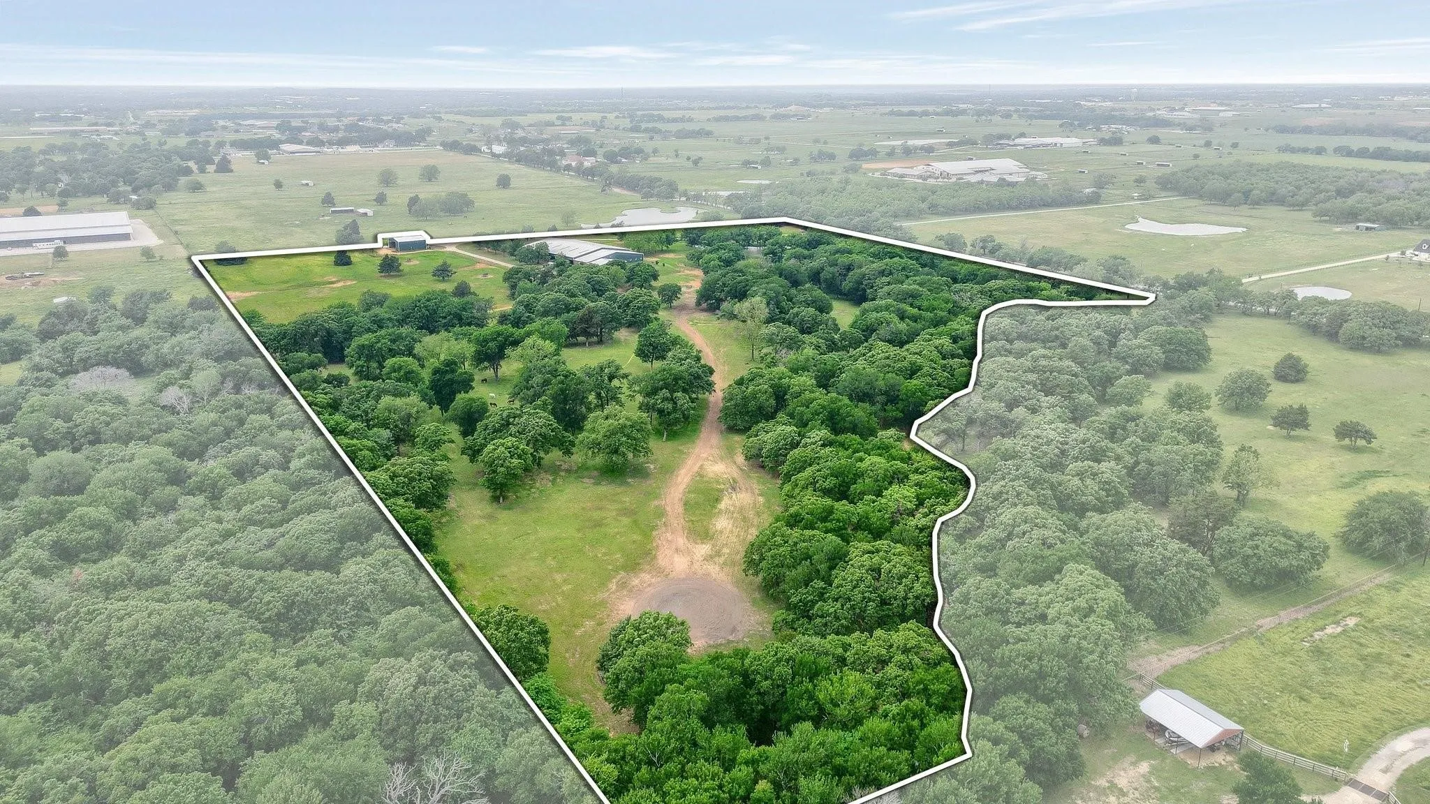 Aerial view of property and surrounding area with property boundaries highlighted