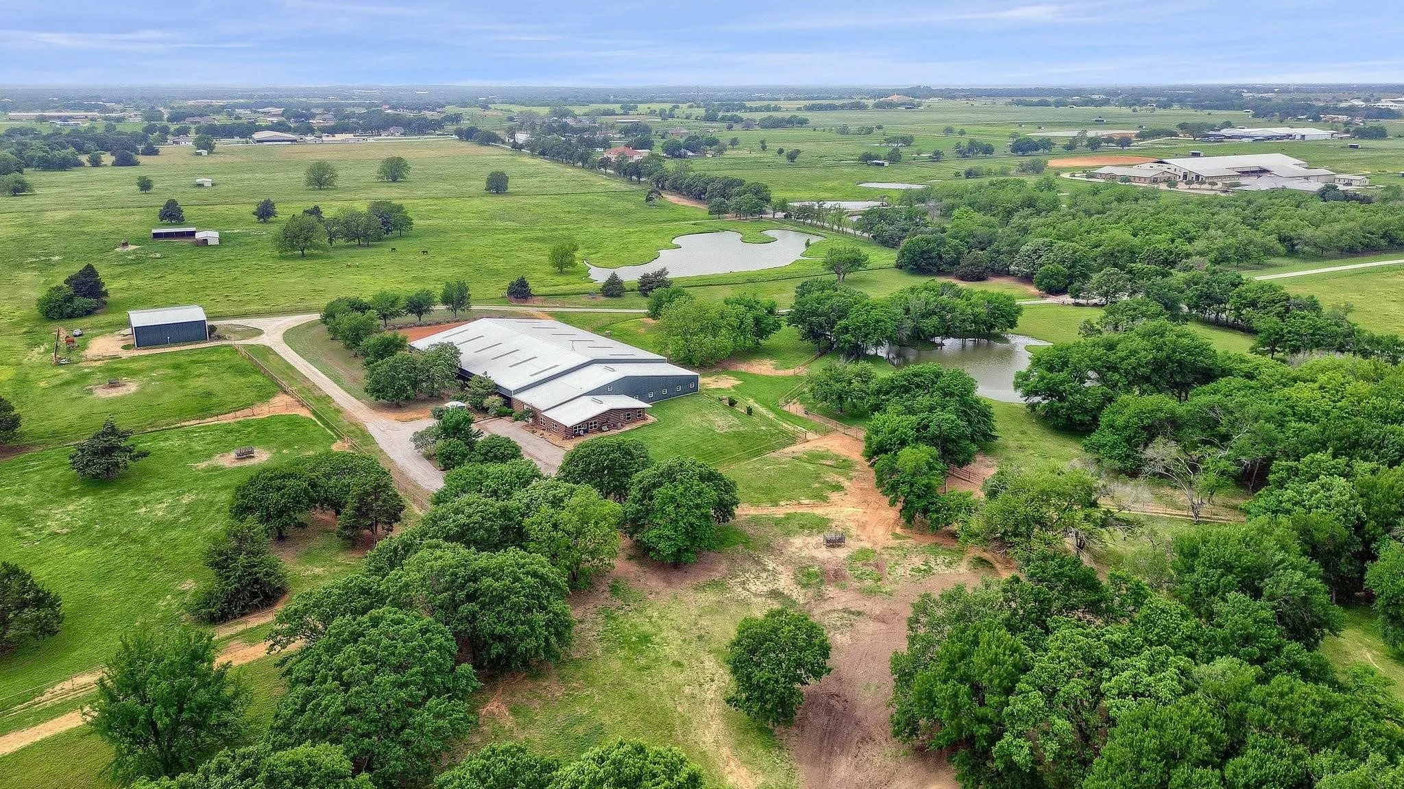 Aerial view of sparsely populated area featuring a nearby body of water