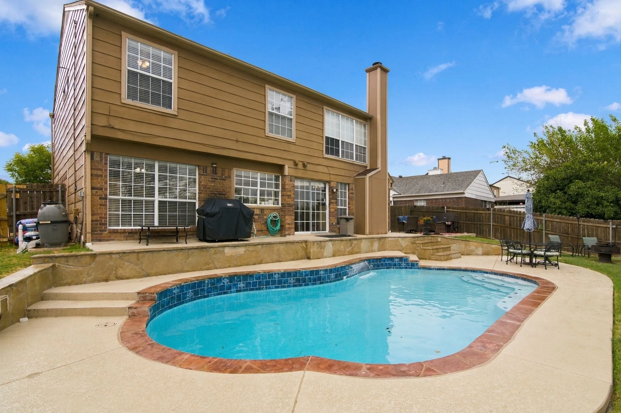 Pool, lighting, cool deck, grassy area and plenty of sitting areas.