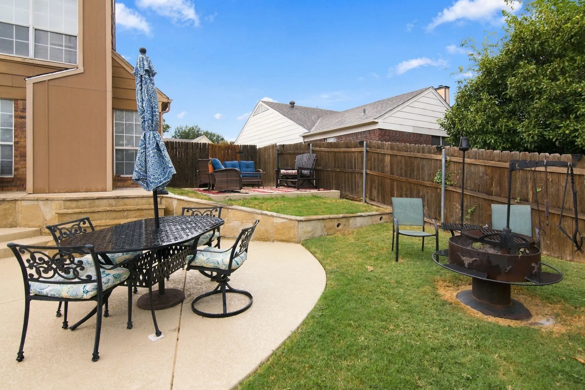 Concrete patio with stone retaining wall