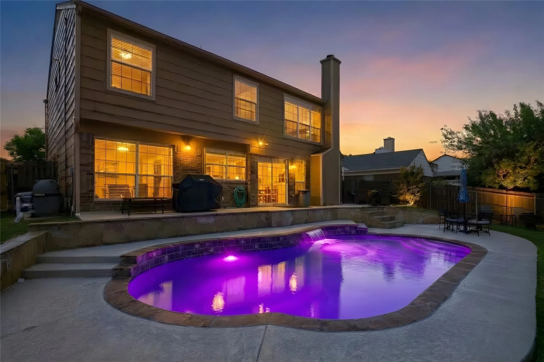 multi-level patio with exterior lighting
