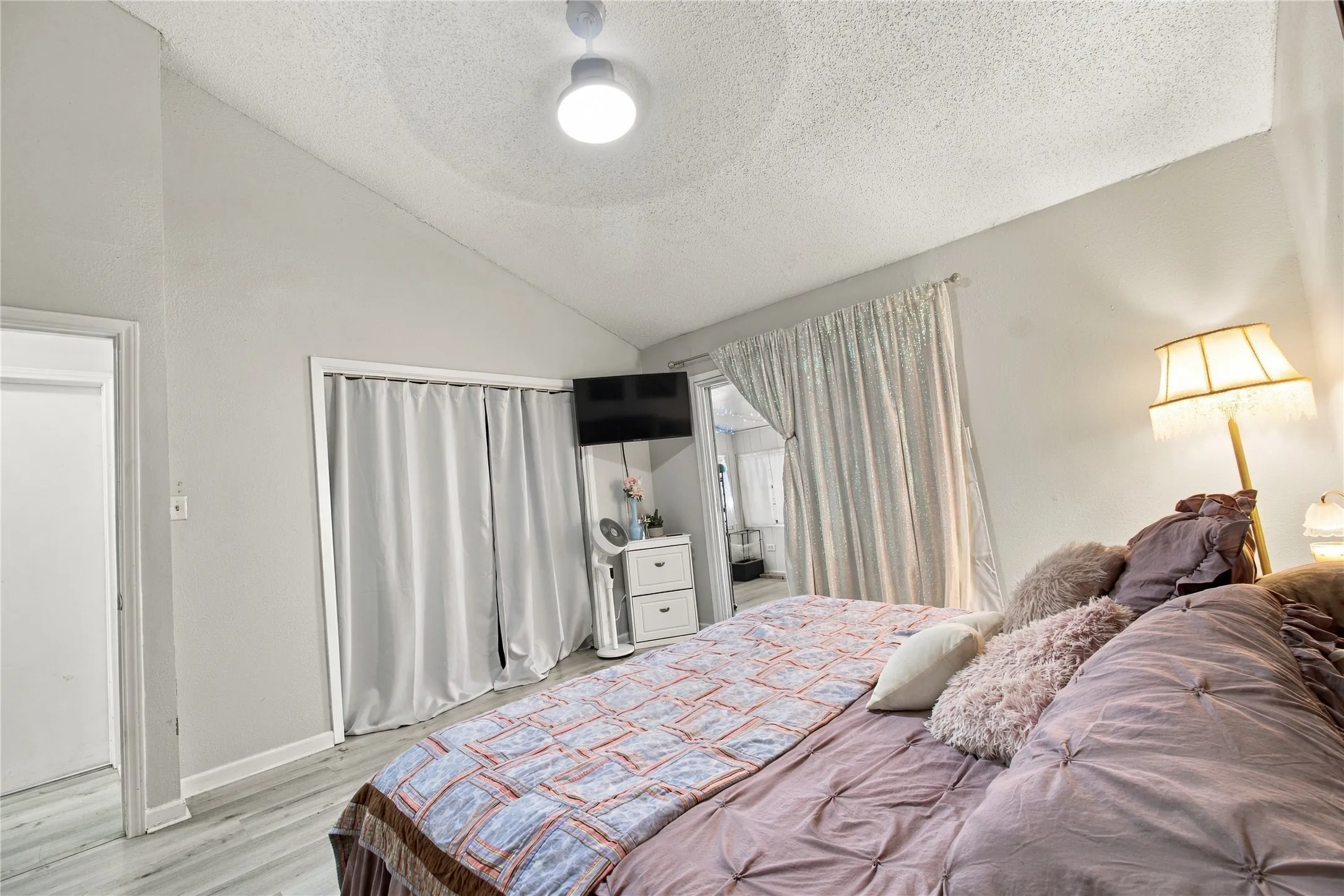 Angled ceiling with a central flush-mount light