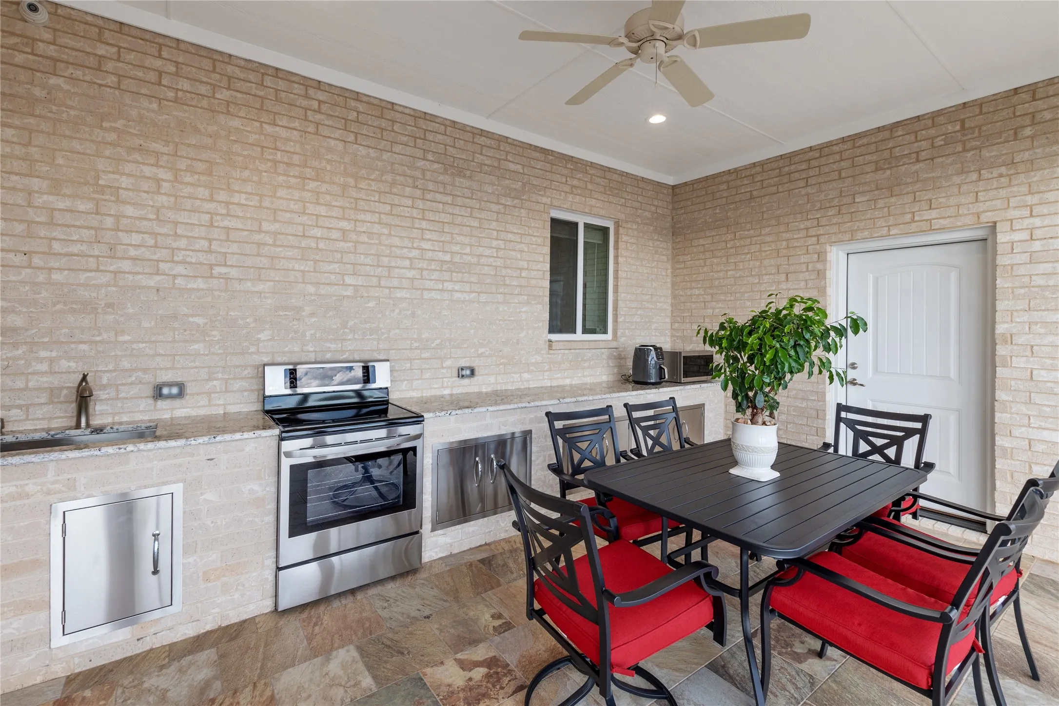 Screened in porch with outdoor kitchen